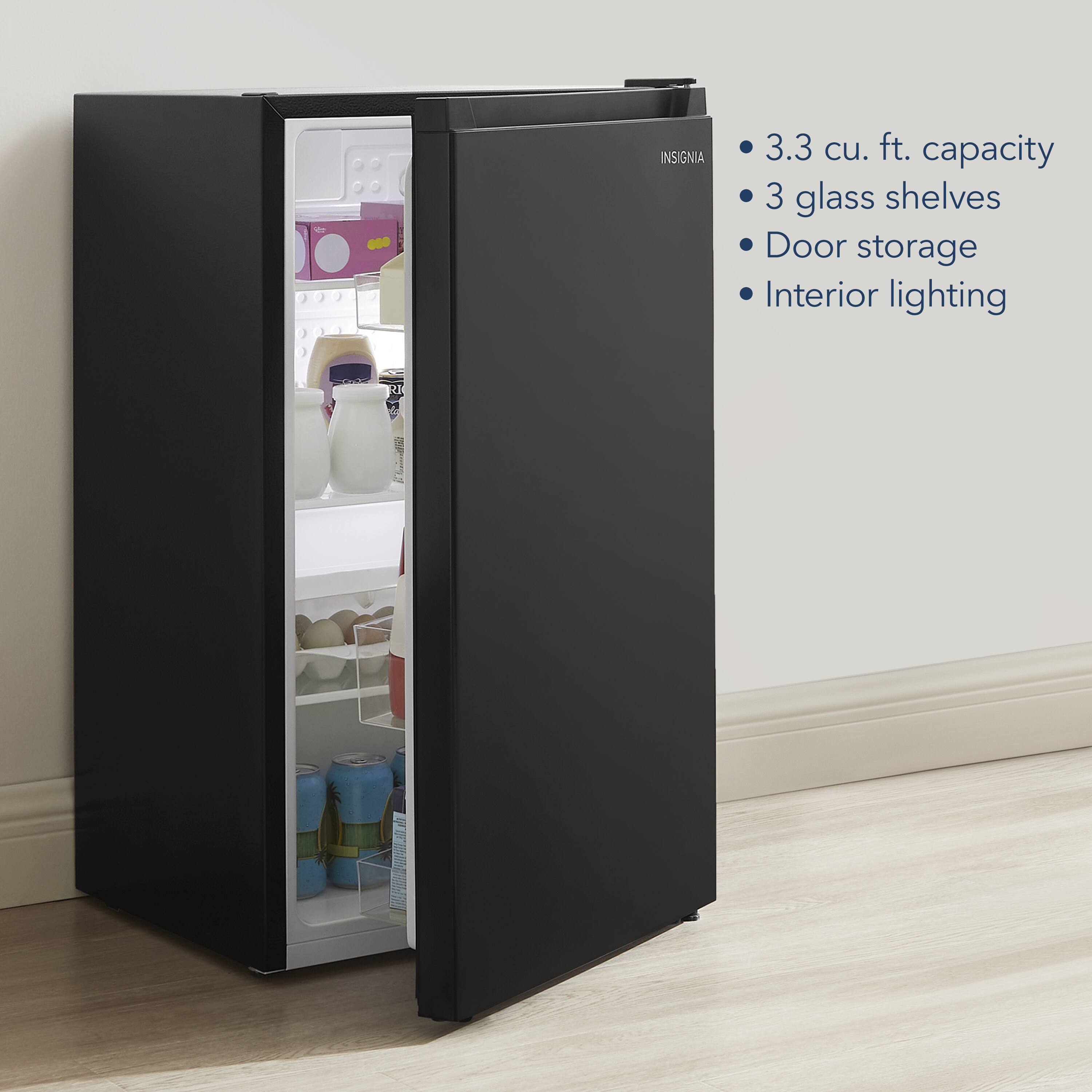 The text on the image reads: "Insignia 3.3 cu. ft. capacity 3 glass shelves Door storage Interior lighting."