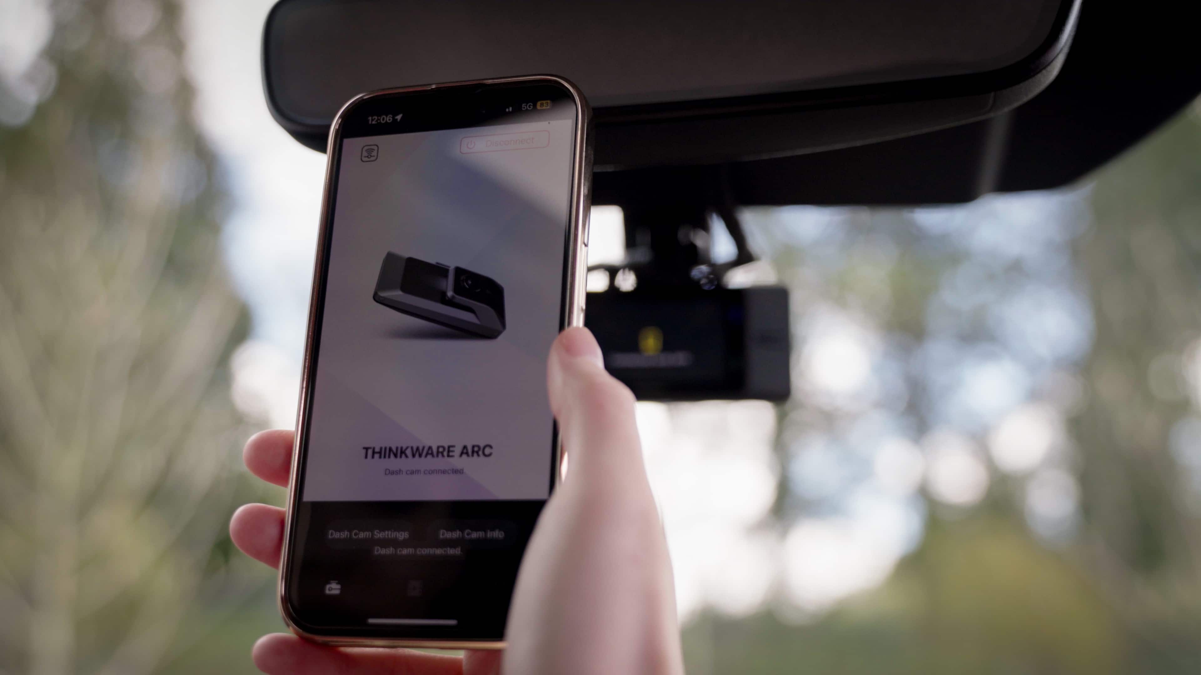 The text on the image reads:
12:06 5G
Disconnect THINKWARE ARC Dash cam connected
Dash Cam Settings
Dash Cam into Dash cam connected