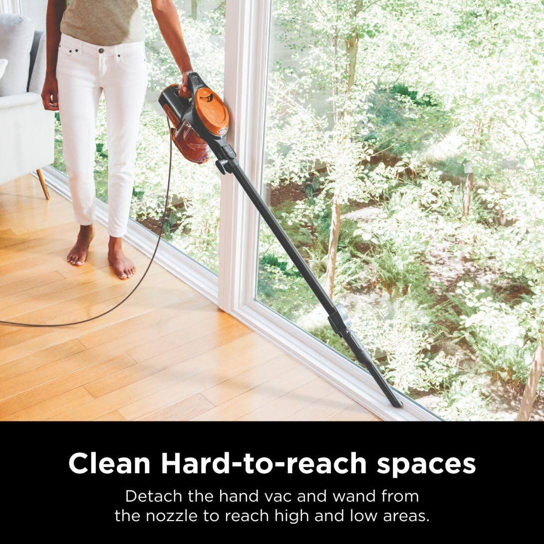 Clean Hard-to-reach spaces  
Detach the hand vac and wand from the nozzle to reach high and low areas.