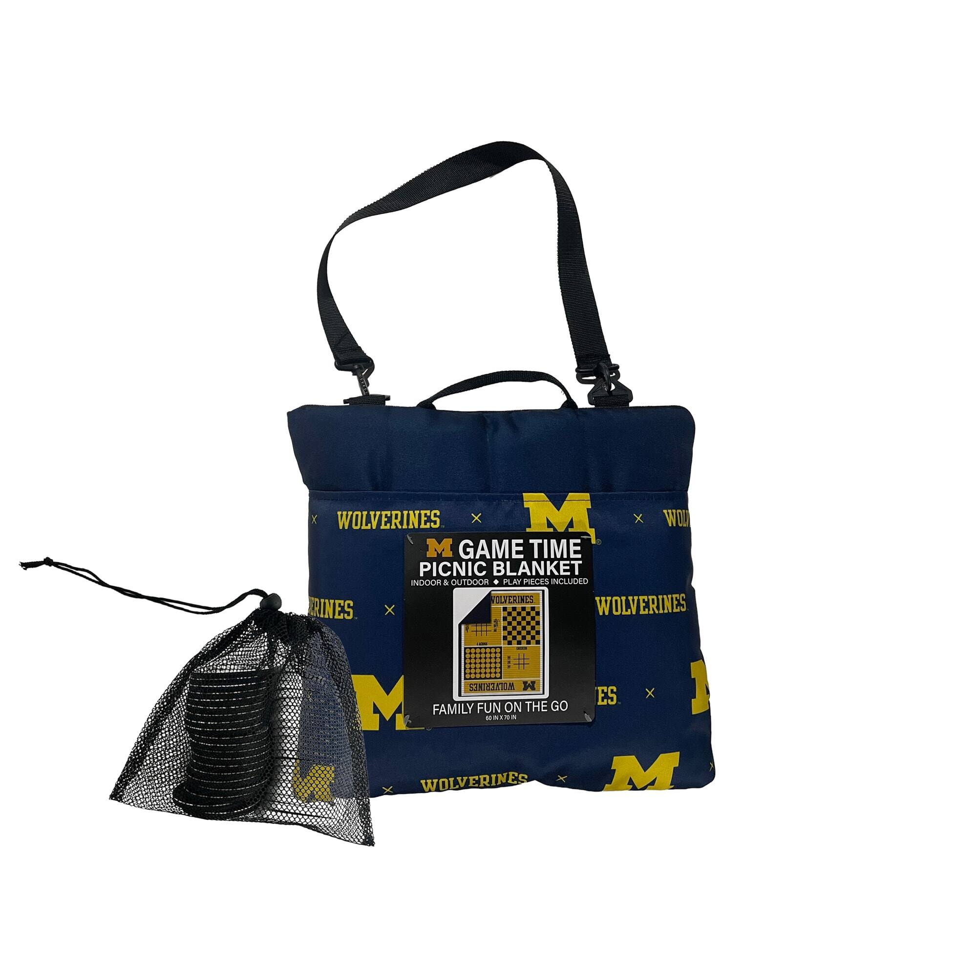 WOLVERINES x M GAME TIME PICNIC BLANKET INDOOR & OUTDOOR. PAN PECES INCLUDED VOL VLTCHINES RINES x WOLVERINES STRIATR 1 ES x M FAMILY FUN HAIS ON THE GO WOLVERINES M