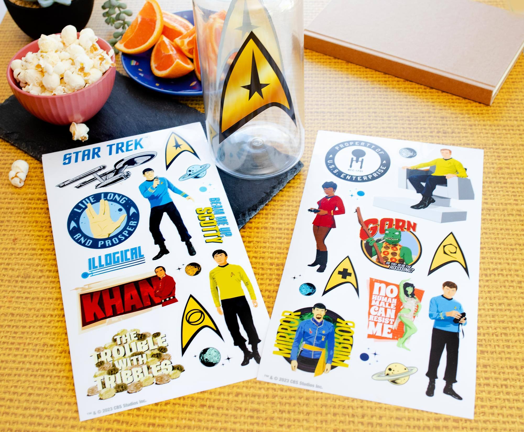 Sure, here is the corrected and grouped text from the image:

---

**STAR TREK**

- LIVE LONG AND PROSPER
- BEAM
- SCOTTY
- ILLOGICAL
- KHAN
- THE TROUBLE WITH TRIBBLES
- 2023 CBS
- PRODUCTION OF U.S.S. ENTERPRISE
- GORN
- no MALE HUMAN CAN RESIST MIRROR ME
- MIRROR
- 2023 CBS

---

This text is organized based on the visible elements in the image.