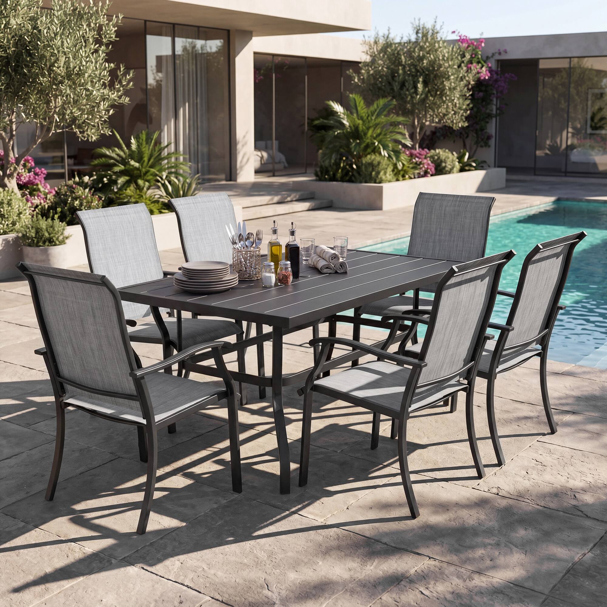 Angle. Nuu Garden - 7-Piece Patio Textilene Dining Set with Umbrella Hole, Powder Coating - Black and Gray.