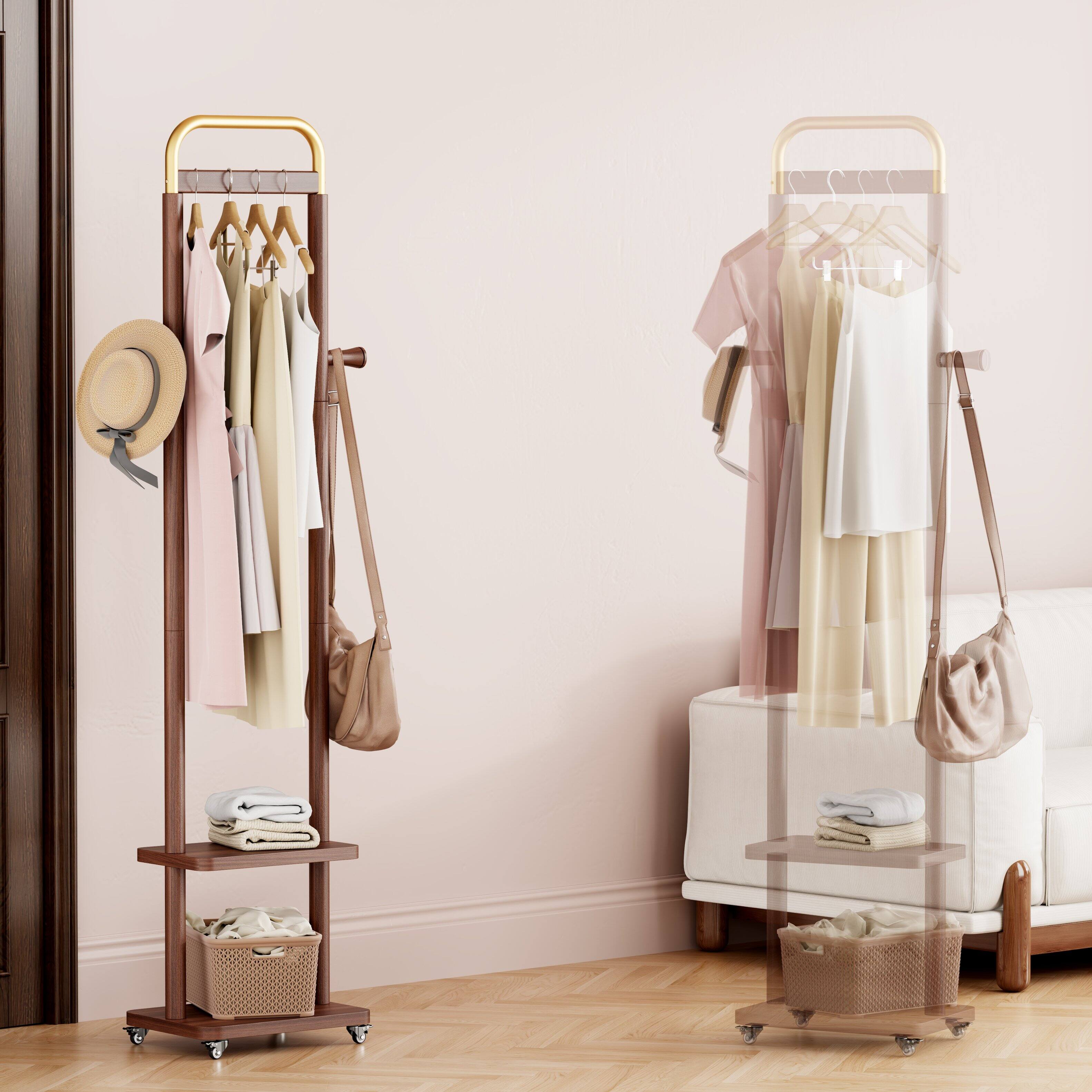 Angle. MERAVOM - Solid Wood Coat Rack Freestanding, Rolling Clothes Rack with 2 Hooks & Shelves, Clothing Rack with Wheels for Bedroom - Walnut.