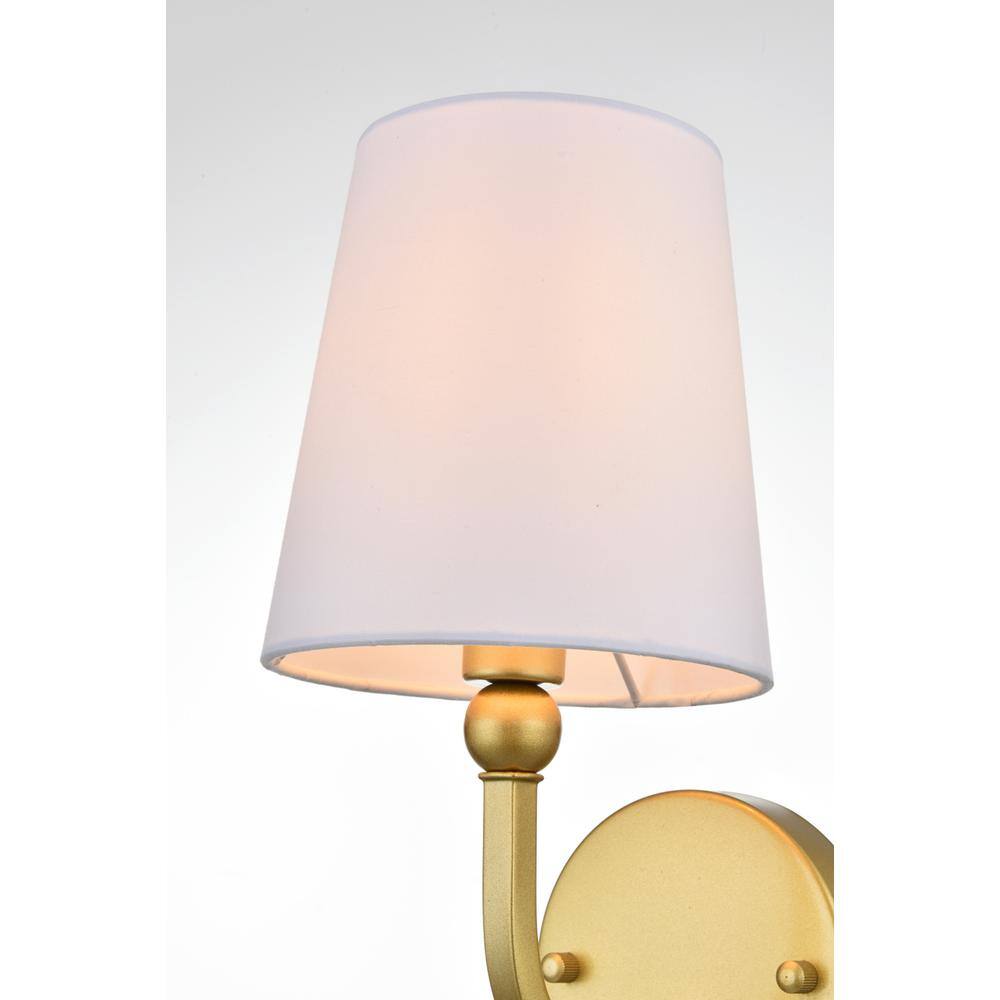 Left. Living District - Colson 1 light Brass and Clear Bath Sconce - Brass And Clear.