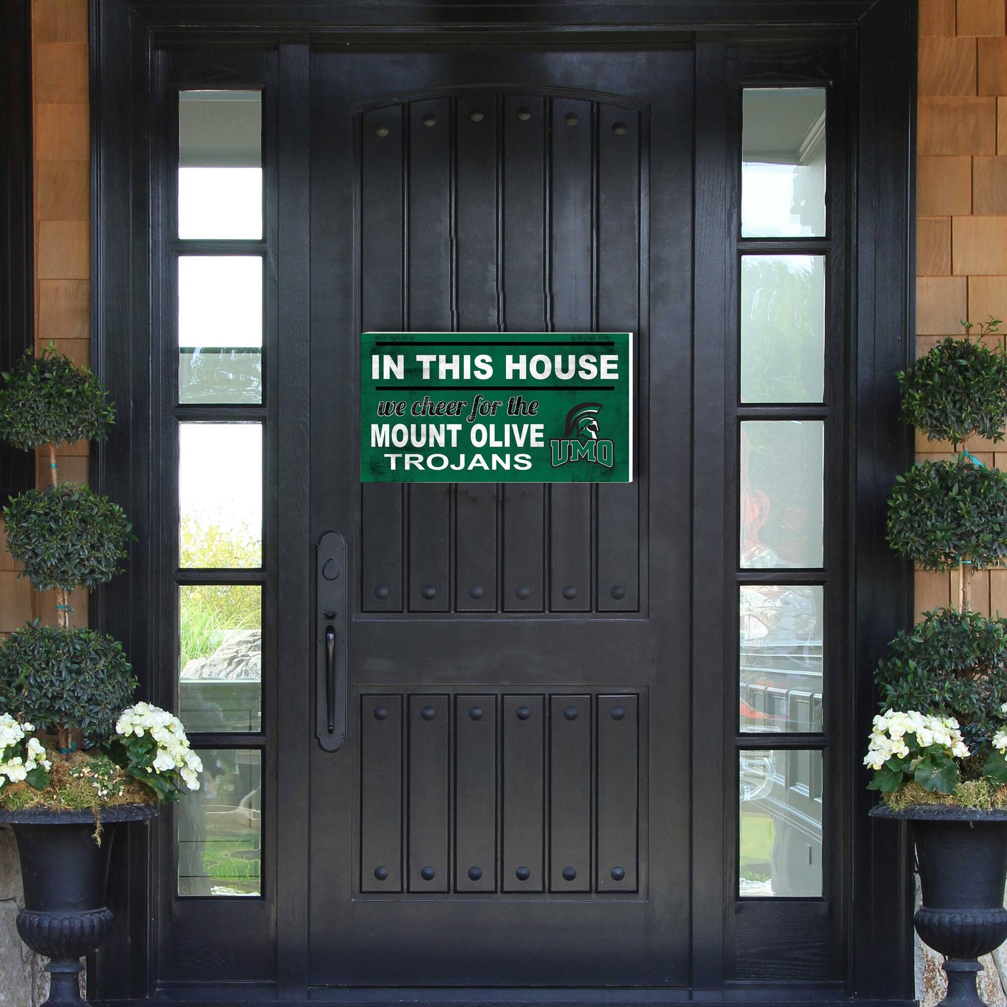 IN THIS HOUSE  
we cheer for the  
MOUNT OLIVE TROJANS  
UMO