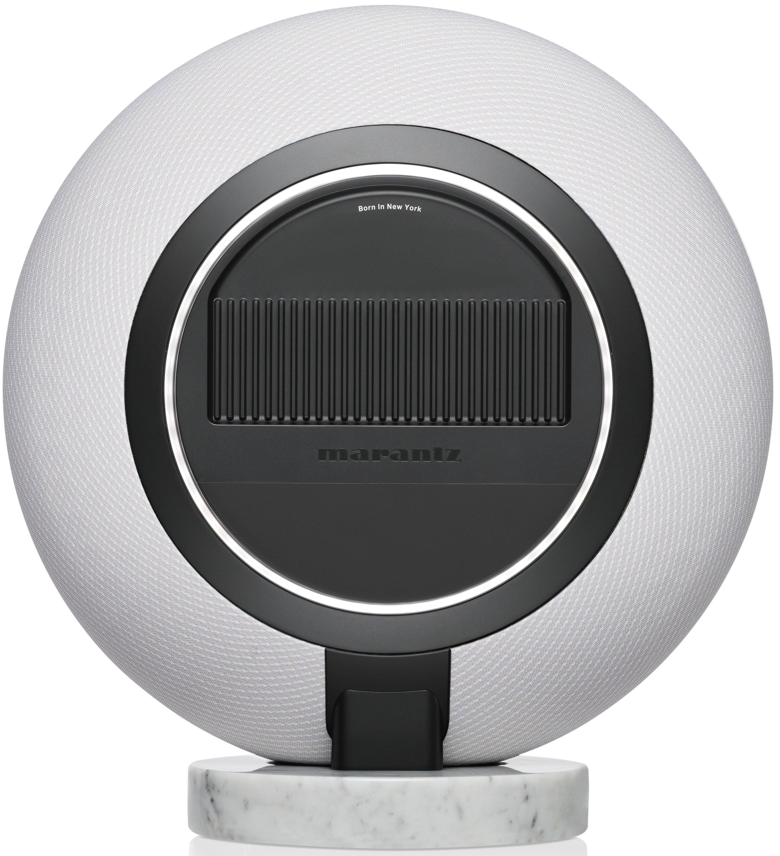 Born in New York, Maraniz is a company that specializes in creating innovative products, such as the Maraniz speaker seen in the image. The speaker is a large, white sphere with a black center, which houses the speaker's technology. The company's focus on design and functionality has led to the creation of this unique and eye-catching speaker.