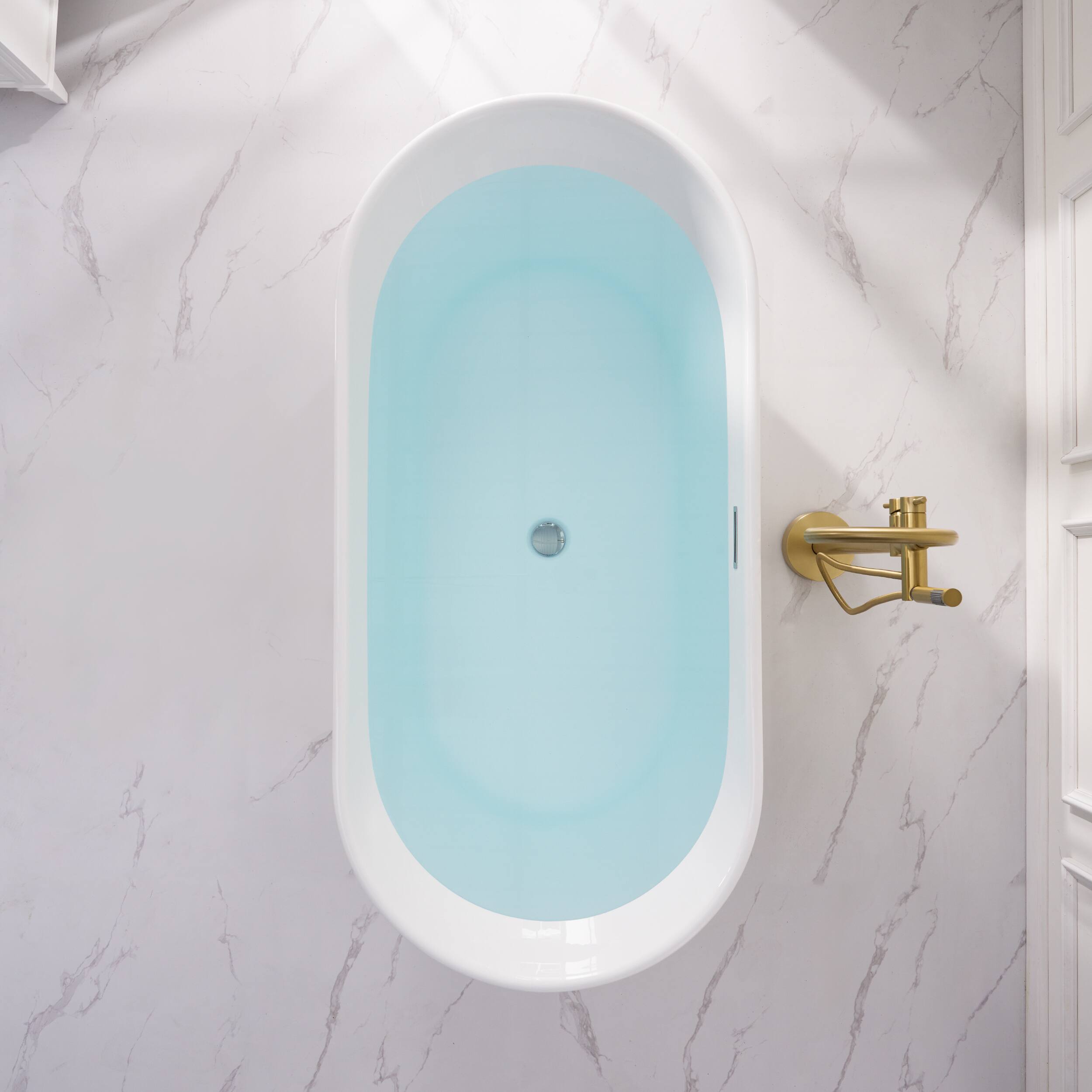 Left. WELLFOR - Lyra 67 in. x 31.5 in. Pure Virgin Acrylic Oval Freestanding Soaking Bathtub with Drain and Overflow - White.