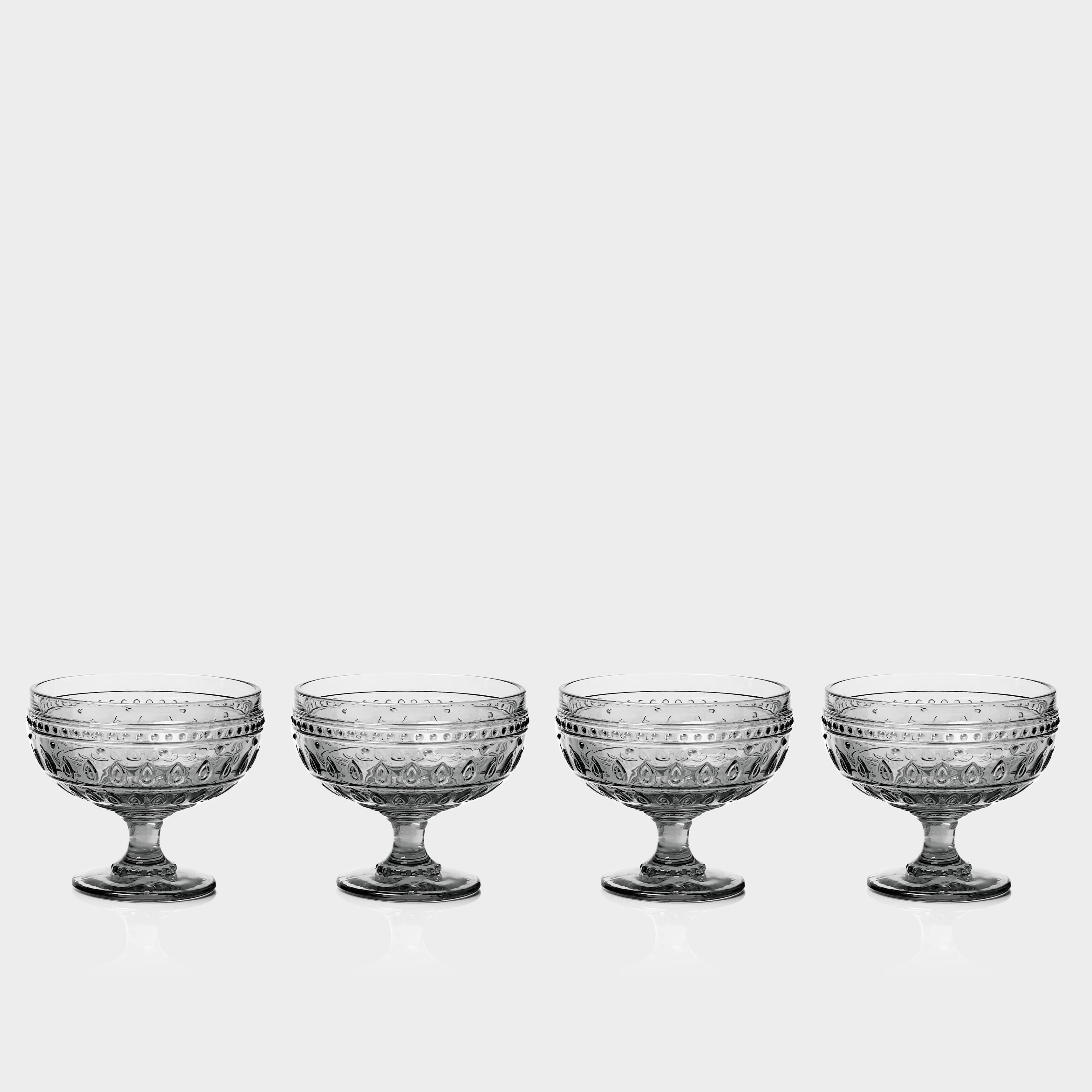 Angle. Euro Ceramica Home - Fez Glassware 4 Piece 13oz Footed Compote Glass Set in Grey - Clear.