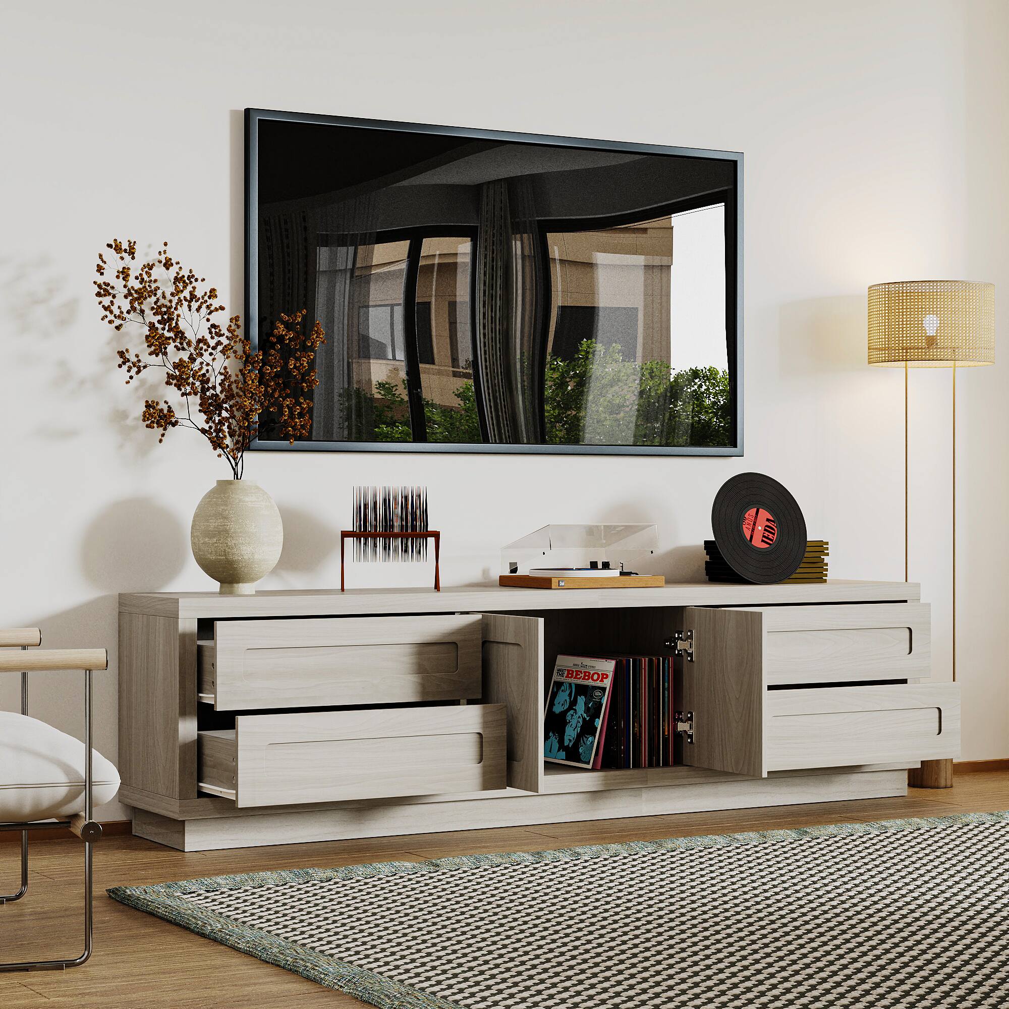 The text "JEDA BEBOP" is not present in the image. The image shows a living room with a dresser, a lamp, and a vase.