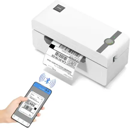 The image shows a person holding a smartphone with a barcode scanner app open. The phone is scanning a barcode on a package, which is placed on a printer or a scanner. The barcode is being read, and the device is likely printing or processing the information from the barcode. The person is likely using the app to track or manage the package, such as a delivery or inventory management.