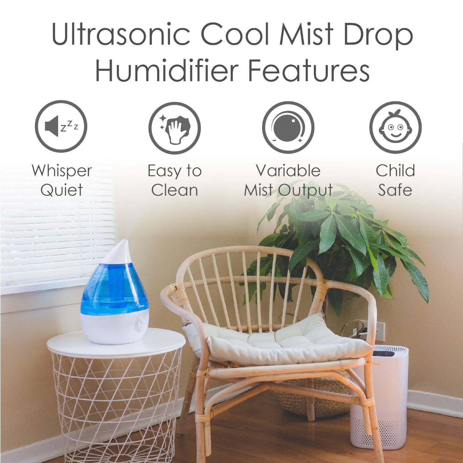 The image features a humidifier with a blue container sitting on a table. The humidifier has a child-safe design and is equipped with a variable mist output feature. It is also whisper quiet, making it an ideal choice for a bedroom or nursery. The humidifier is placed on a chair, and there is a potted plant nearby, adding a touch of greenery to the room.