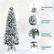 The image shows a Christmas tree with a reinforced tree top, snow-flocked branch tips, and a pre-attached hinged design. It also features a folding metal stand, which is a convenient and space-saving option for displaying the tree.