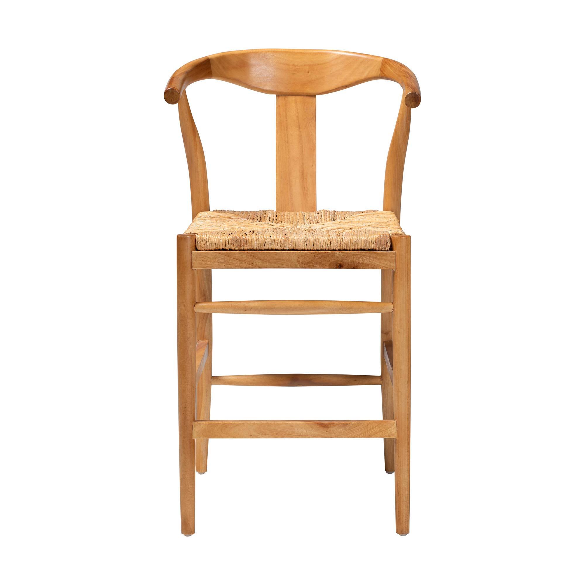 Angle. bali & pari - Fika Counter Stool with Woven Seagrass Seat - Handwoven Wicker Stool with Arms and Wishbone Backrest, Coastal Seating - Honey/Natural Brown.