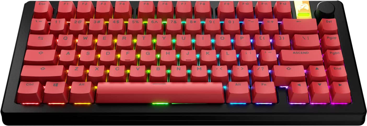 The image shows a close-up of a red keyboard with a colorful rainbow pattern. The keys are labeled with numbers and letters, including the function keys F1 to F12. The keyboard also has a numeric keypad, and the letters A to Z are visible on the keys. The arrangement of the keys is as follows:
1. 1! 2 3# 4$ 5% 6 78 8 9( 0) ) = Del
2. IT Q W E R T Y U I O P
3. PgUp A S D F G H J K L
4. PgDn Z X C V B N M < > /?
5. End Ctrl == Alt Alt Fn
