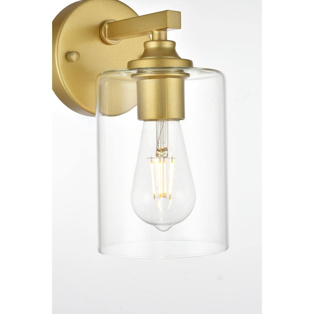Left. Living District - Mayson 1 light Brass and Clear Bath Sconce - Brass And Clear.