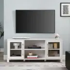 I cannot group or correct the text as it is not coherent or related to the image. The image shows a living room with a flat screen TV, a white entertainment center, and a potted plant. There are also books and a vase on the entertainment center.