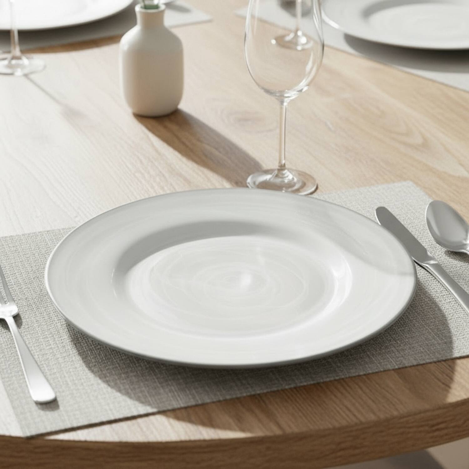 Angle. American Atelier - Alabaster Glass Charger Plate with Silver Rim 13"D - Silver.