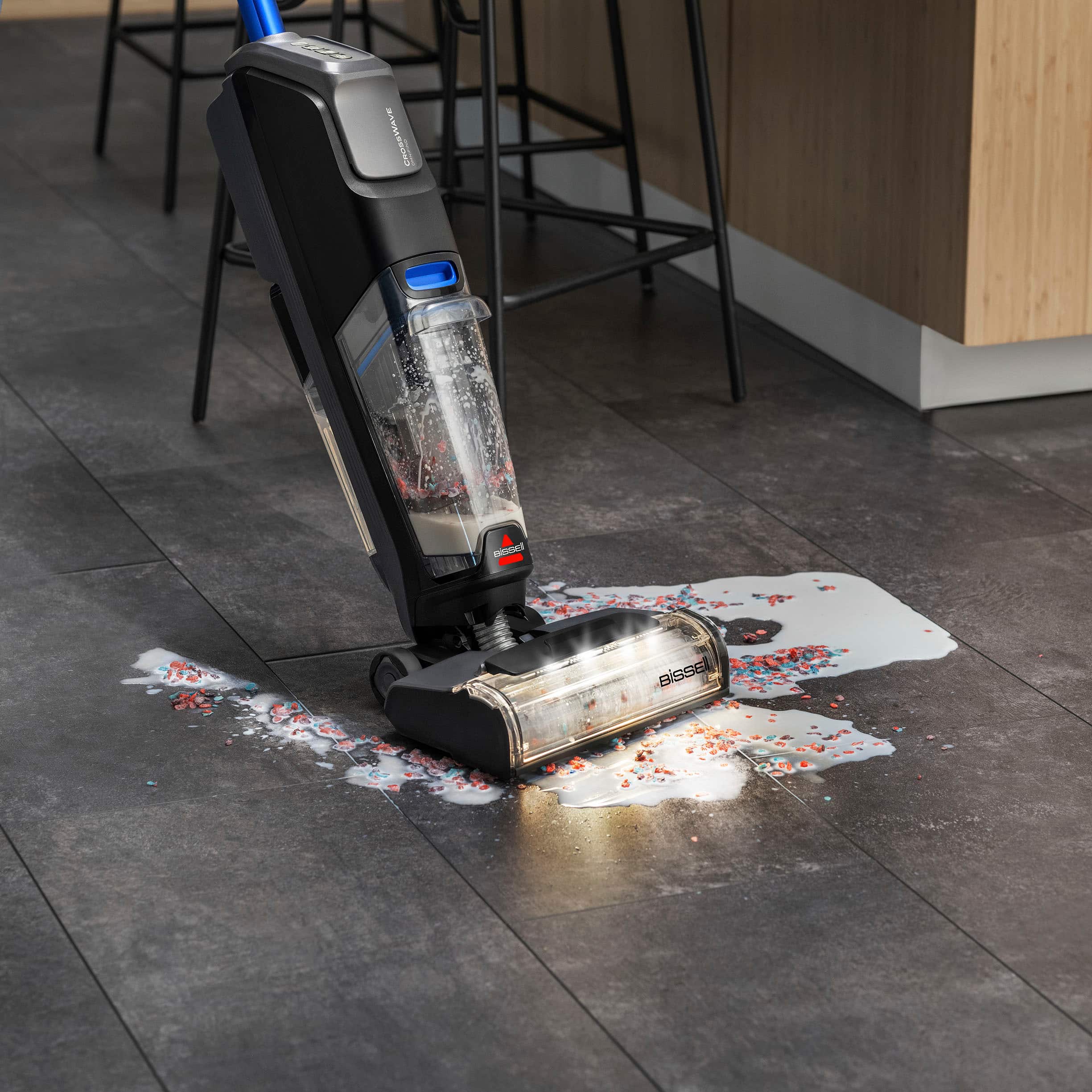 The text on the image reads "MAUN MusOsI I E BISSE 1S." However, it is not clear what this text represents or its relevance to the image. The image shows a robotic vacuum cleaner with a spilled liquid on the floor, which is likely the main focus of the image.