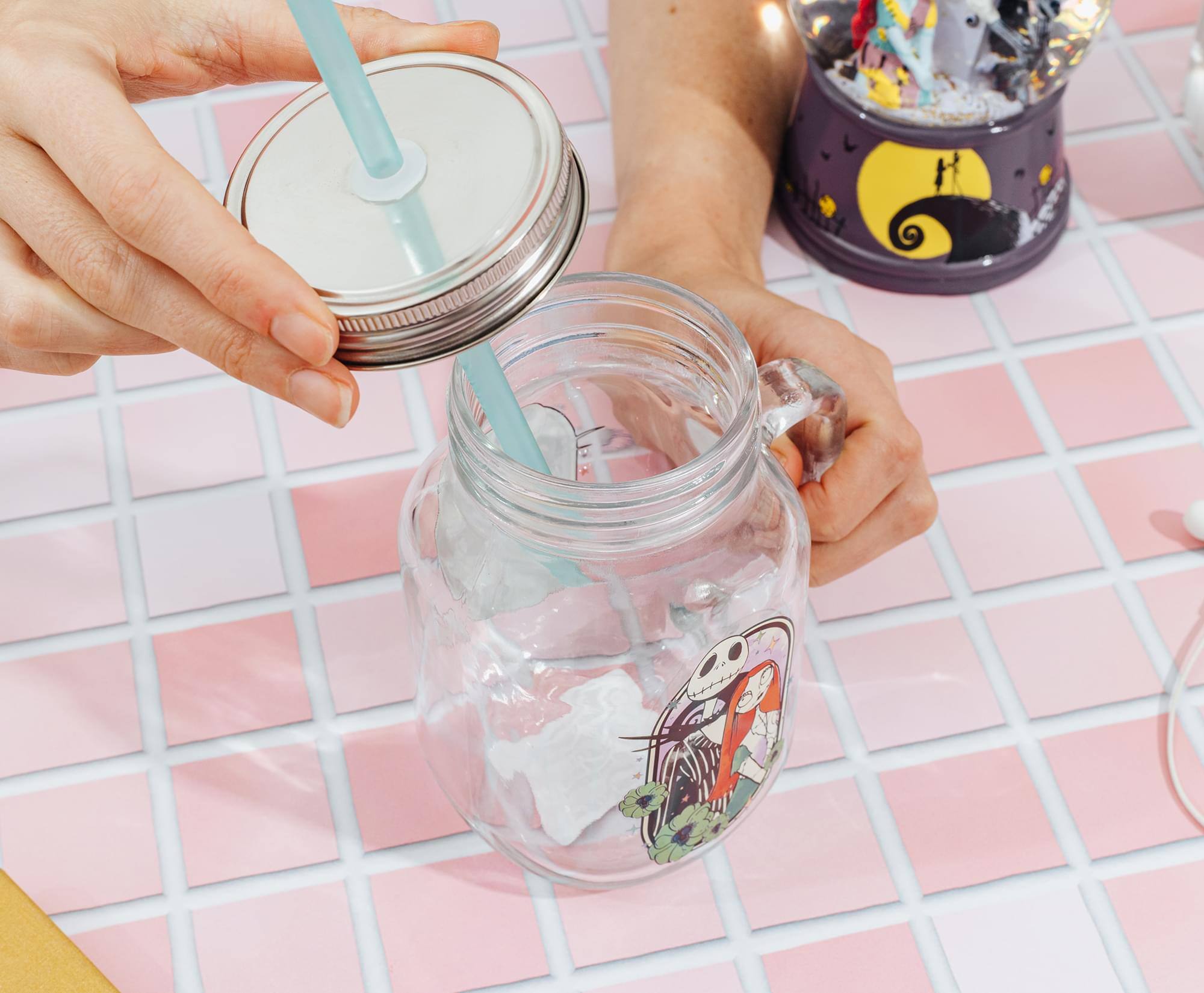 Alt View 2. Silver Buffalo - Disney The Nightmare Before Christmas Jack and Sally 21-Ounce Glass Mason Jar - Multi-Colored.