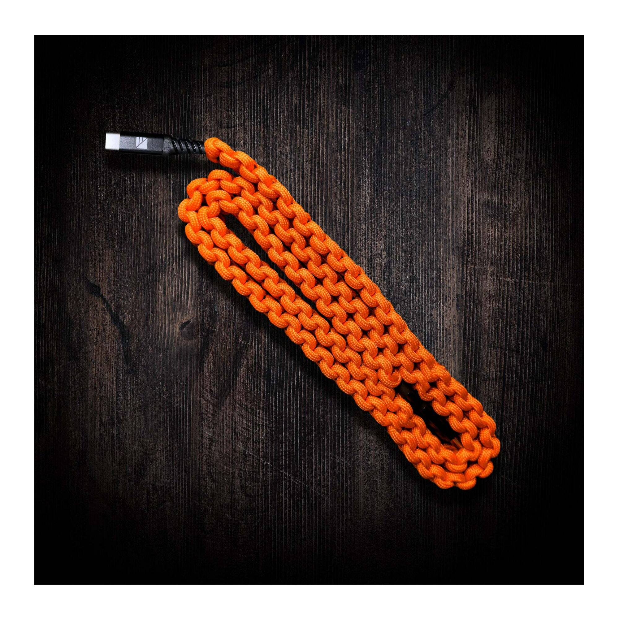 Angle. Dark Energy - Dark Energy 6 Feet USB C to C Paracord Hi Vis Orange Cable with Leather Strap.