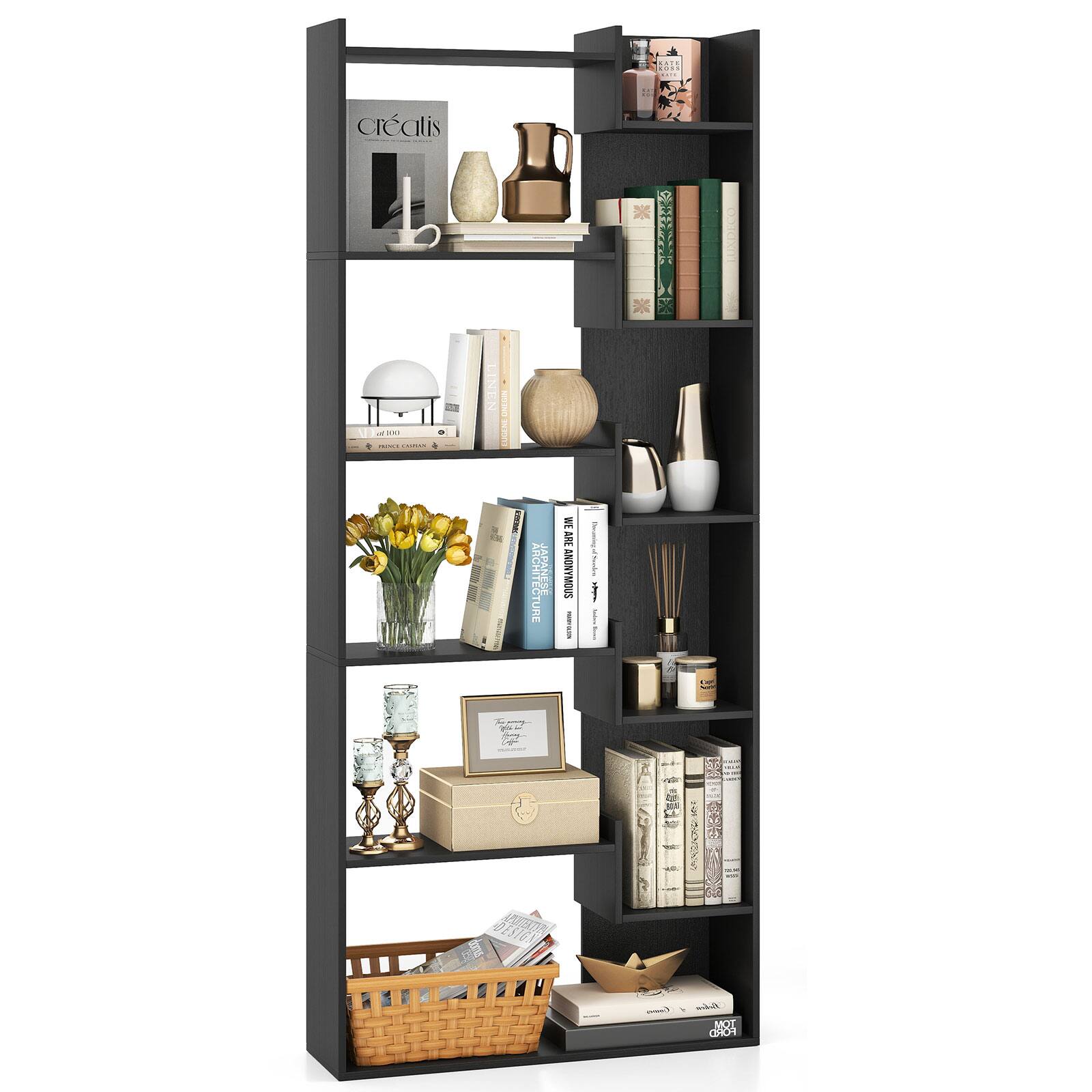 The image features a black bookshelf filled with various items, including books, vases, and other decorative objects. There are a total of 14 books arranged on the shelves, with some placed horizontally and others vertically. Additionally, there are three vases of different sizes and shapes, adding to the visual appeal of the bookshelf. The arrangement of these items creates an aesthetically pleasing display, showcasing the diverse interests and tastes of the owner.