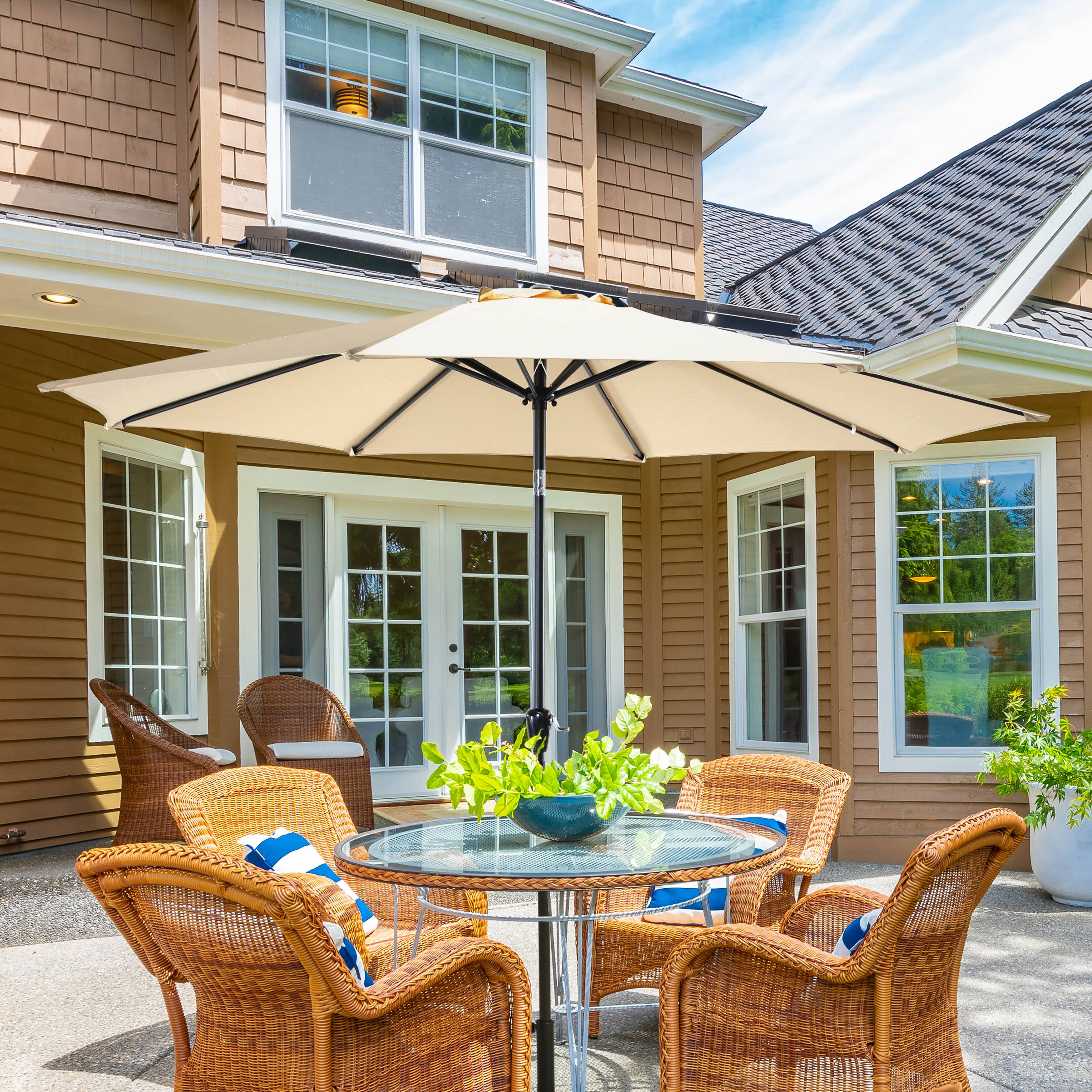 Angle. Nuu Garden - Outdoor 10' Round Patio Vented Umbrella, Crank, Push Button Tilt with Base - Beige.