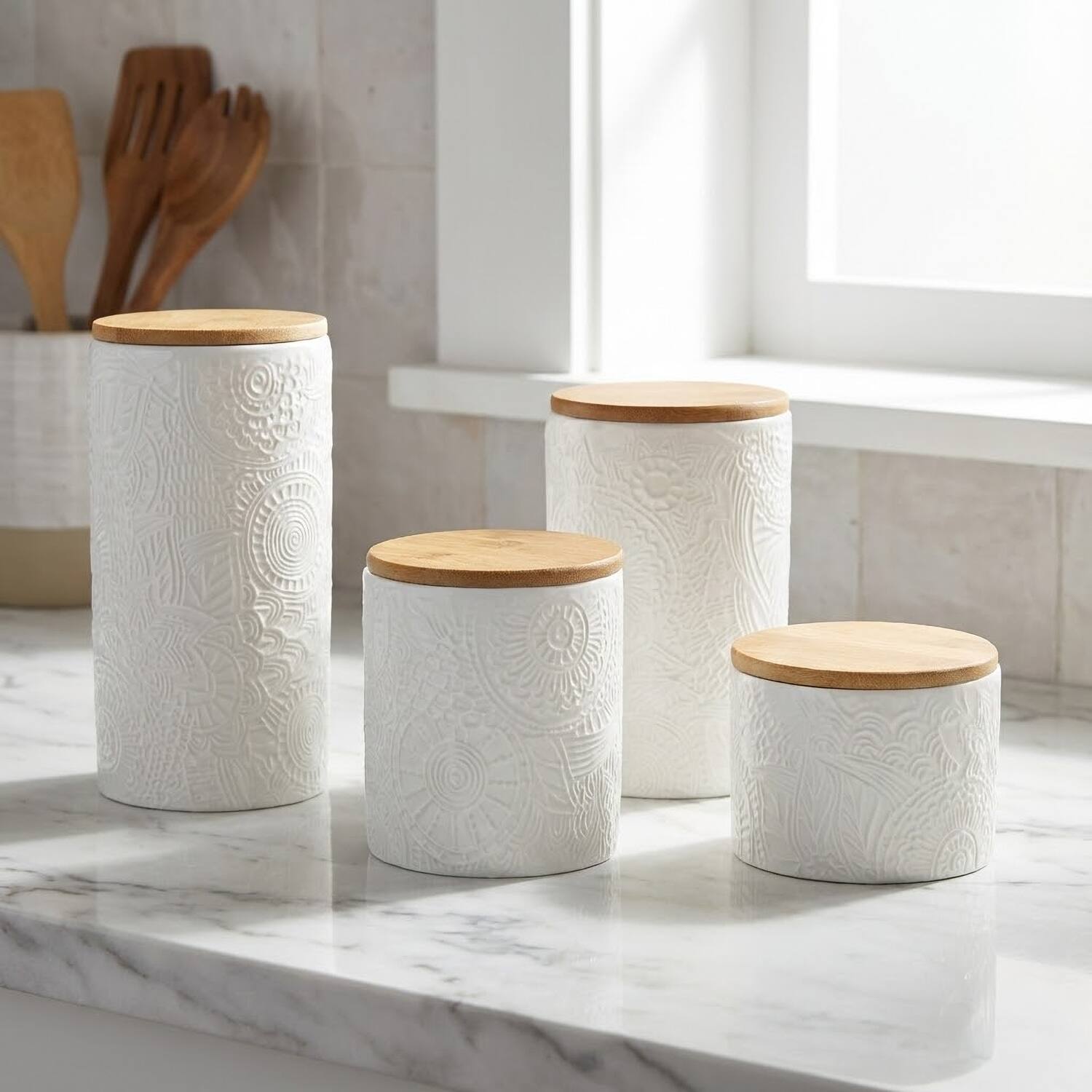 Left. American Atelier - 4-Piece Embossed White Canister Set with Lids (Assorted Sizes).
