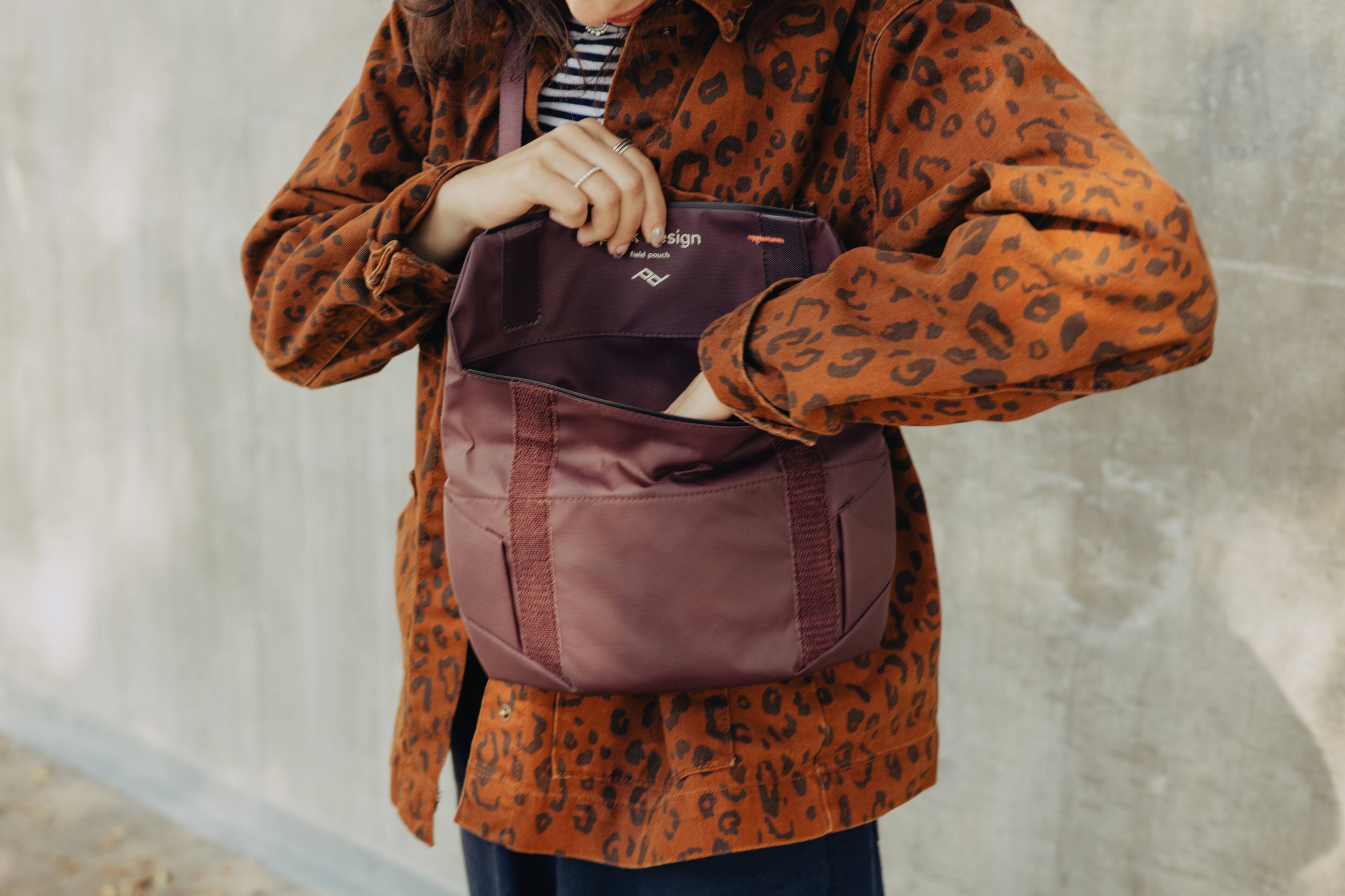 The text on the bag reads:

"design
hand pouch"