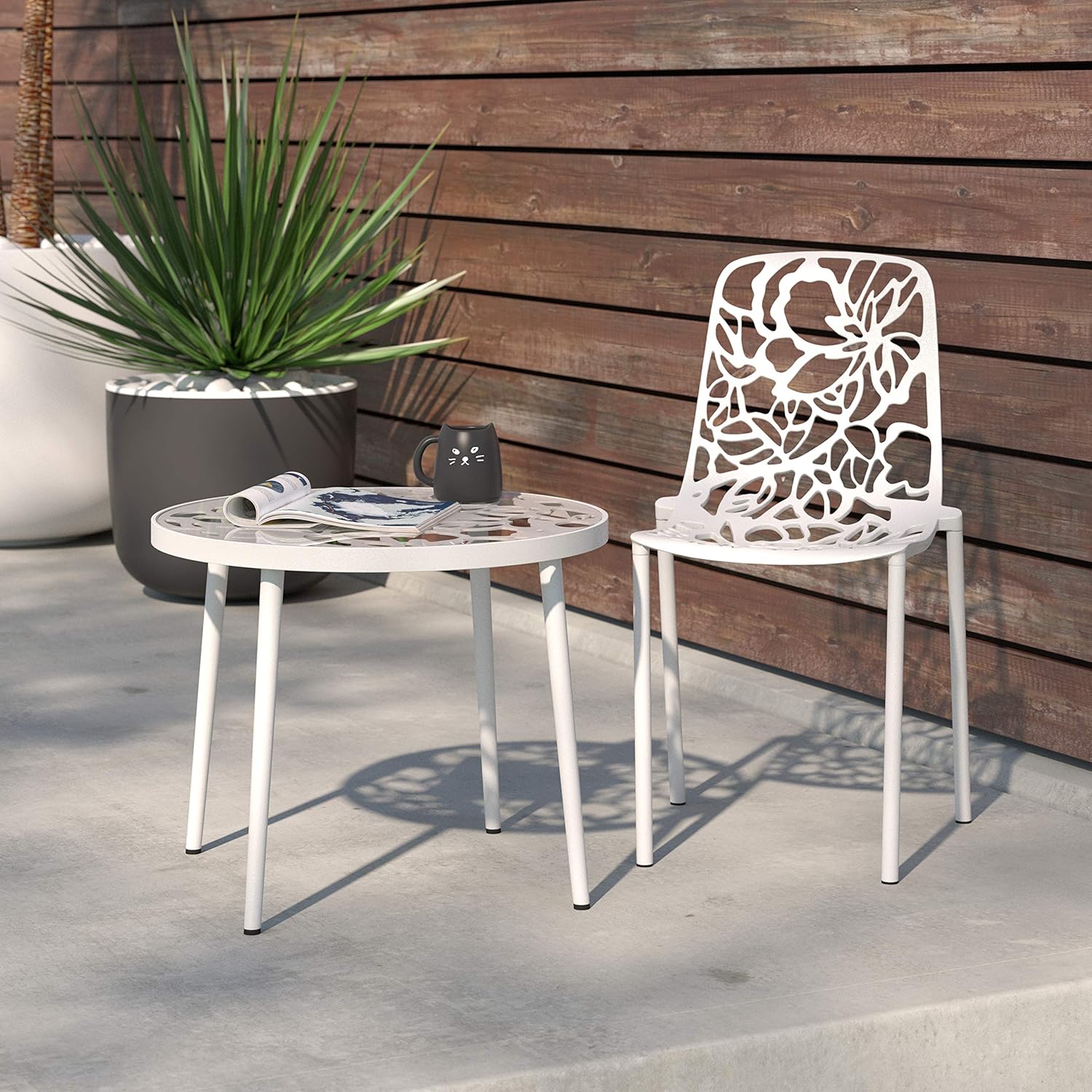 Angle. LeisureMod - Devon Stackable Aluminum Dining Chair, Modern Floral Cutout Indoor/Outdoor Patio Chair - Fully Assembled - White.