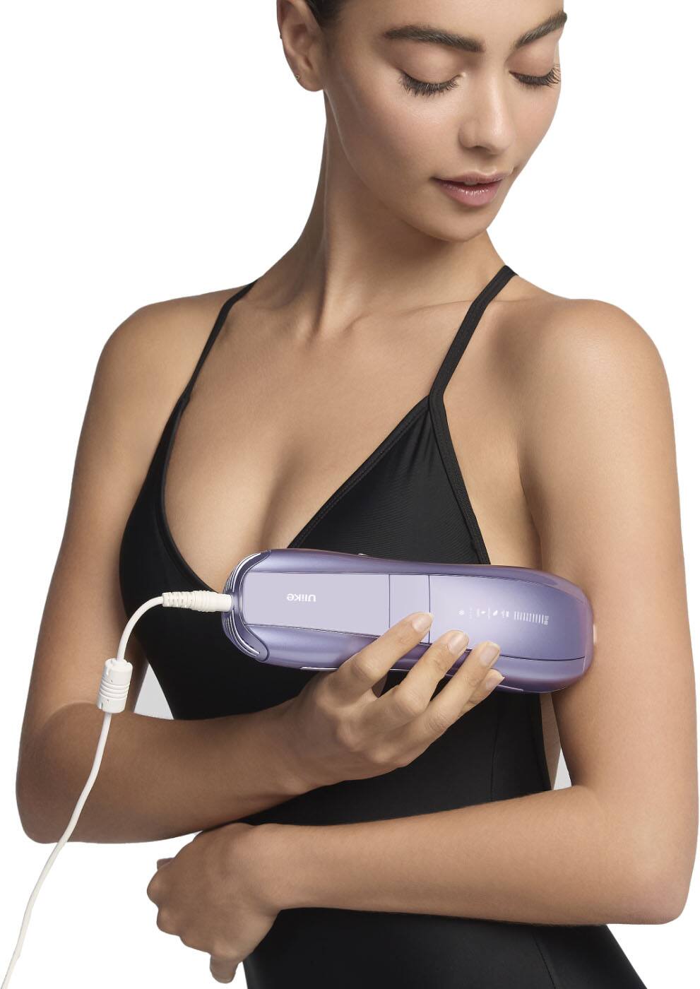 "Ulike 18 HIE" is a phrase that does not make sense in the context of the image. It is not related to the content of the image, which features a woman holding a purple device. The phrase could be a typo or an unrelated statement.