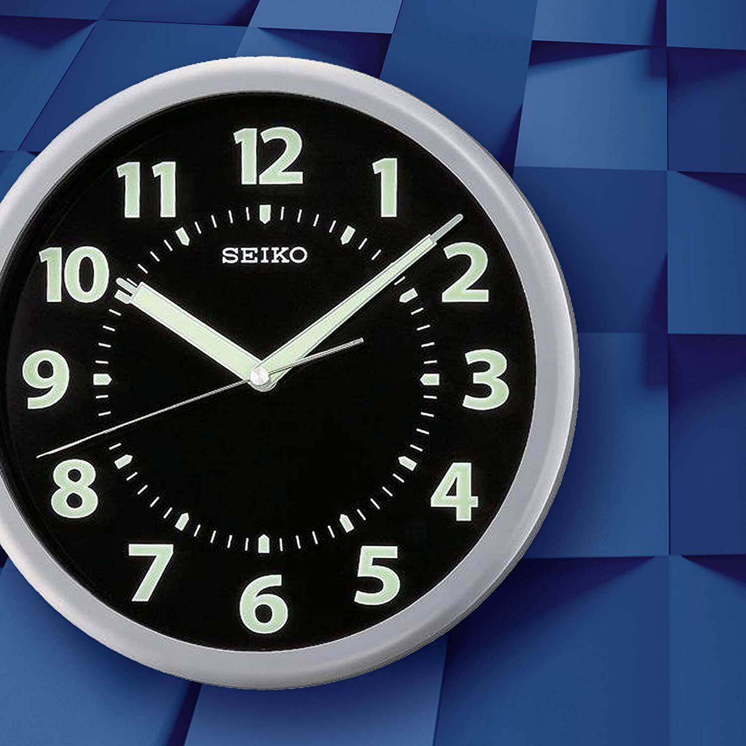 Angle. Seiko - Seiko 10" Easy Reader Black Wall Clock with Luminous Glow-In-The-Dark Hands - Silver Tone Metallic.