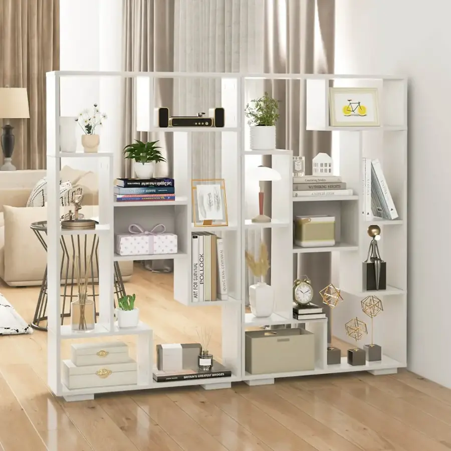 The image features a room with a white bookshelf filled with various items. The bookshelf is adorned with a clock, a vase, and a potted plant. There are also several books placed on the shelves, and a few decorative items such as a bowl and a bottle. The room has a cozy and organized atmosphere, with the bookshelf serving as a focal point in the space.