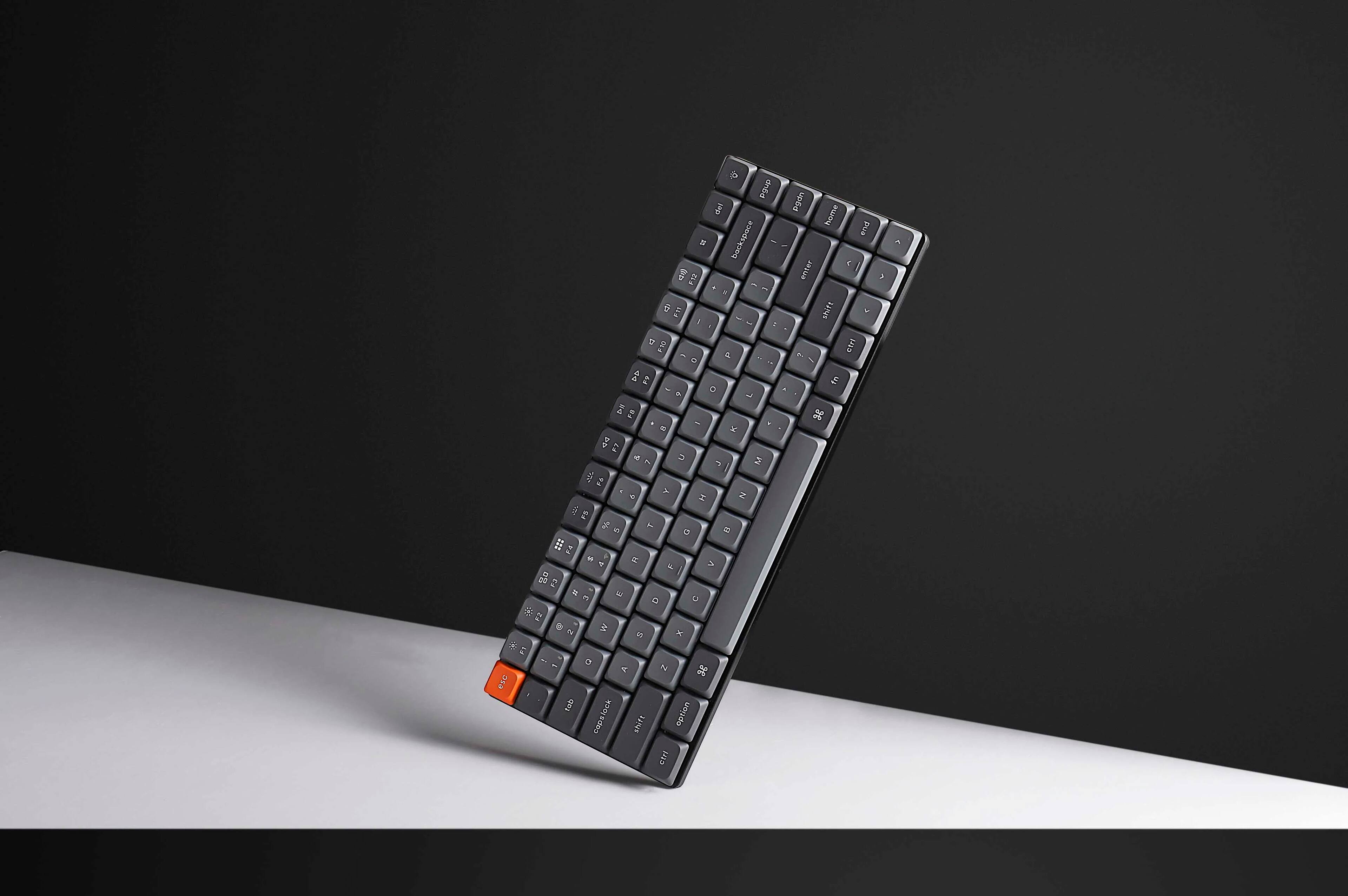 The text on the image is a keyboard layout, which is a diagram of the keys on a keyboard. The layout is for a keyboard with a numeric keypad, and it includes the numbers 1 through 9, as well as other keys such as the enter, shift, and backspace keys. The layout is designed to help users understand the positioning and arrangement of the keys on the keyboard.