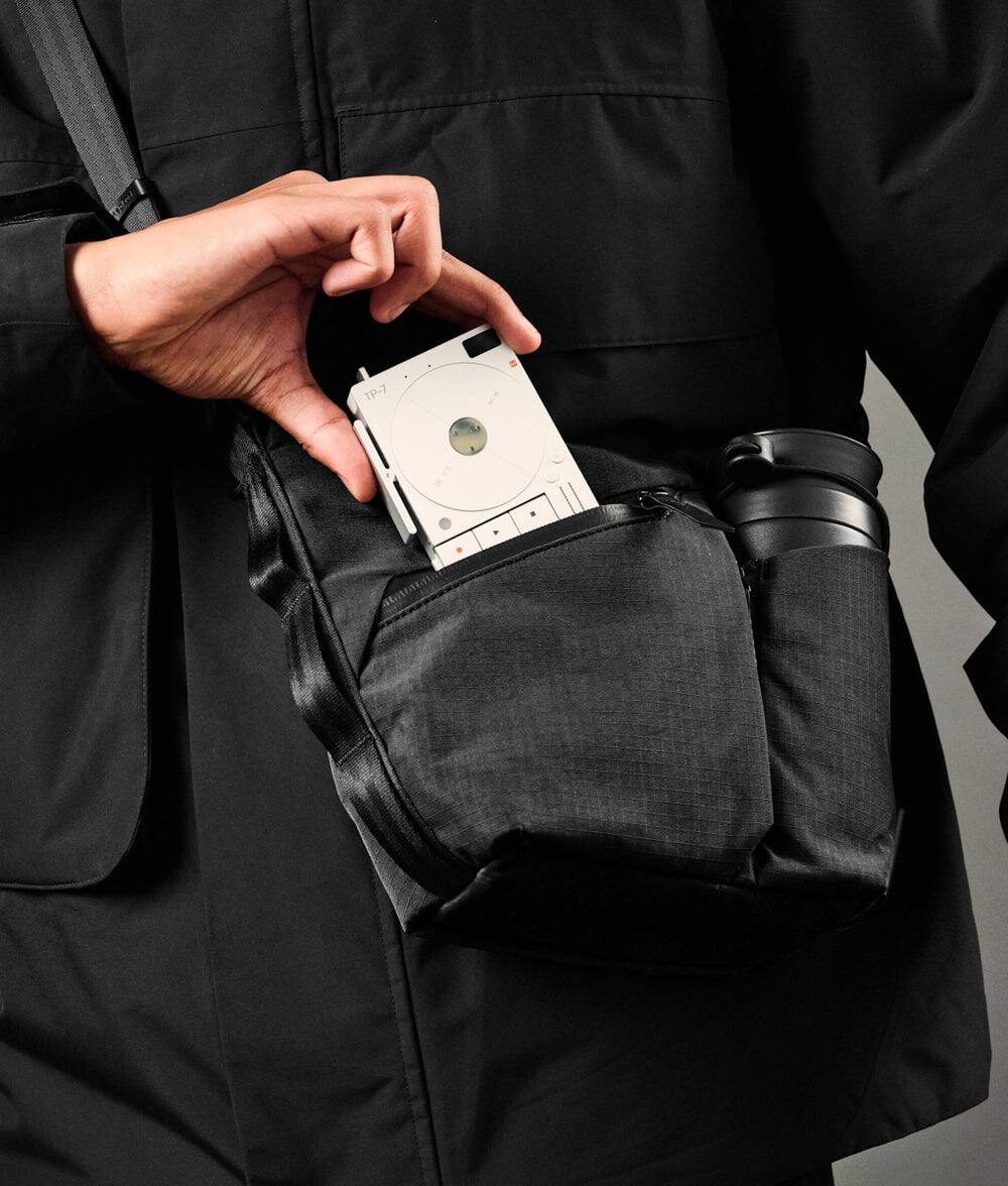 Left. ALPAKA - Flow Satchel Mini 2L Crossbody Bag, Water Resistant Shoulder Bag, Expandable Bottle Pocket, YKK Zippers - Black Axoflux 210D.