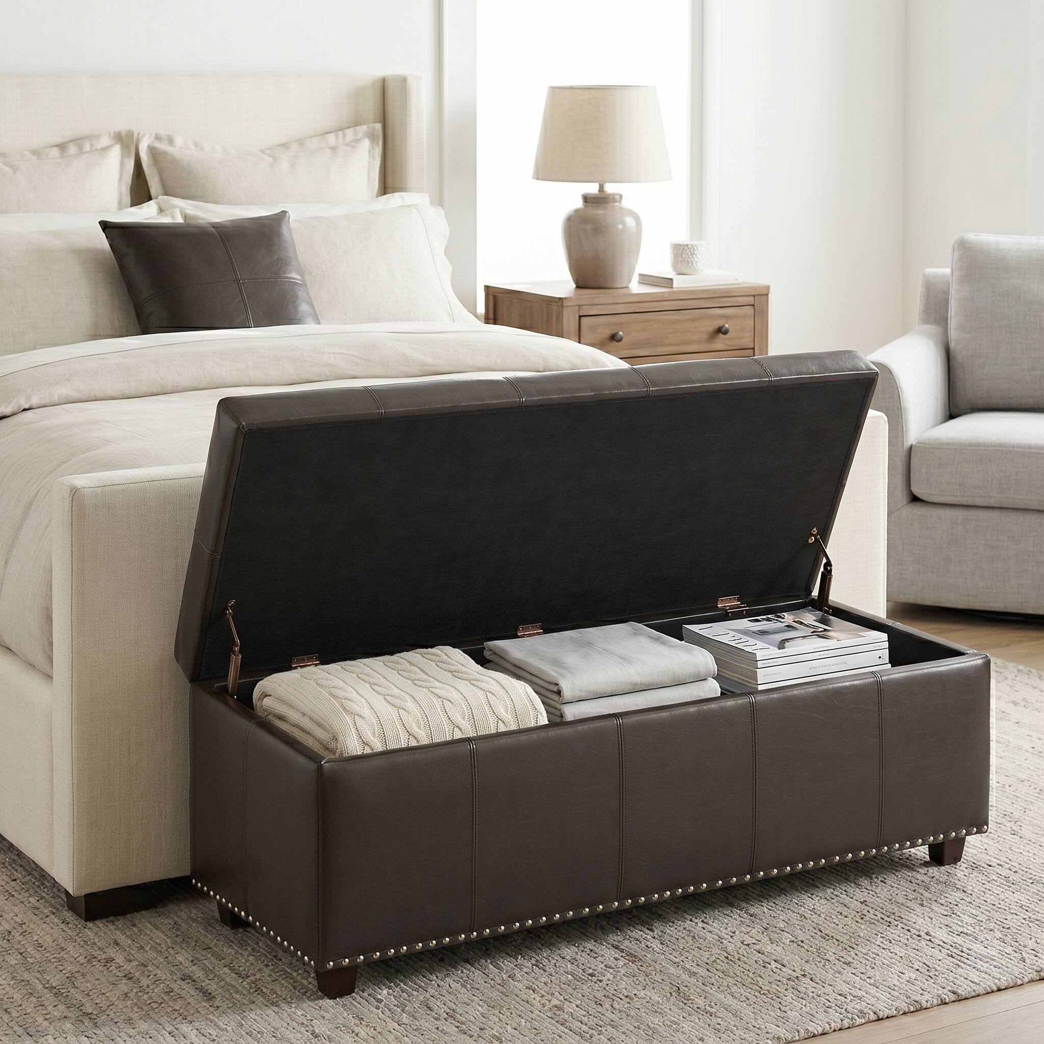 Left. Simpli Home - Kingsley 48 inch Wide Large Storage Ottoman in Coffee Brown Vegan Leather - Coffee Brown.