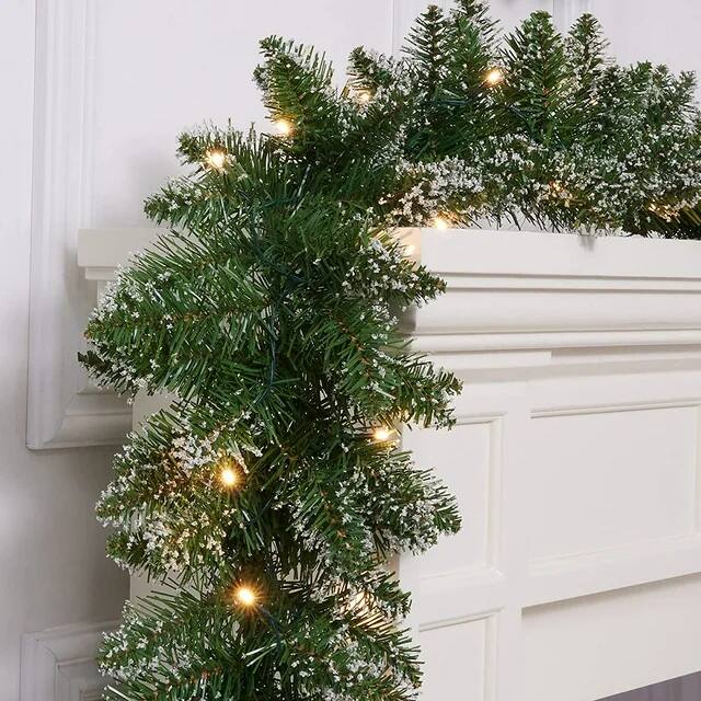 Angle. MOVSSOU - 18ft Christmas Garland 50 LED Lights Pre-Lit Artificial Xmas Garland Snow Flocked Wall Christmas Decorations - green.