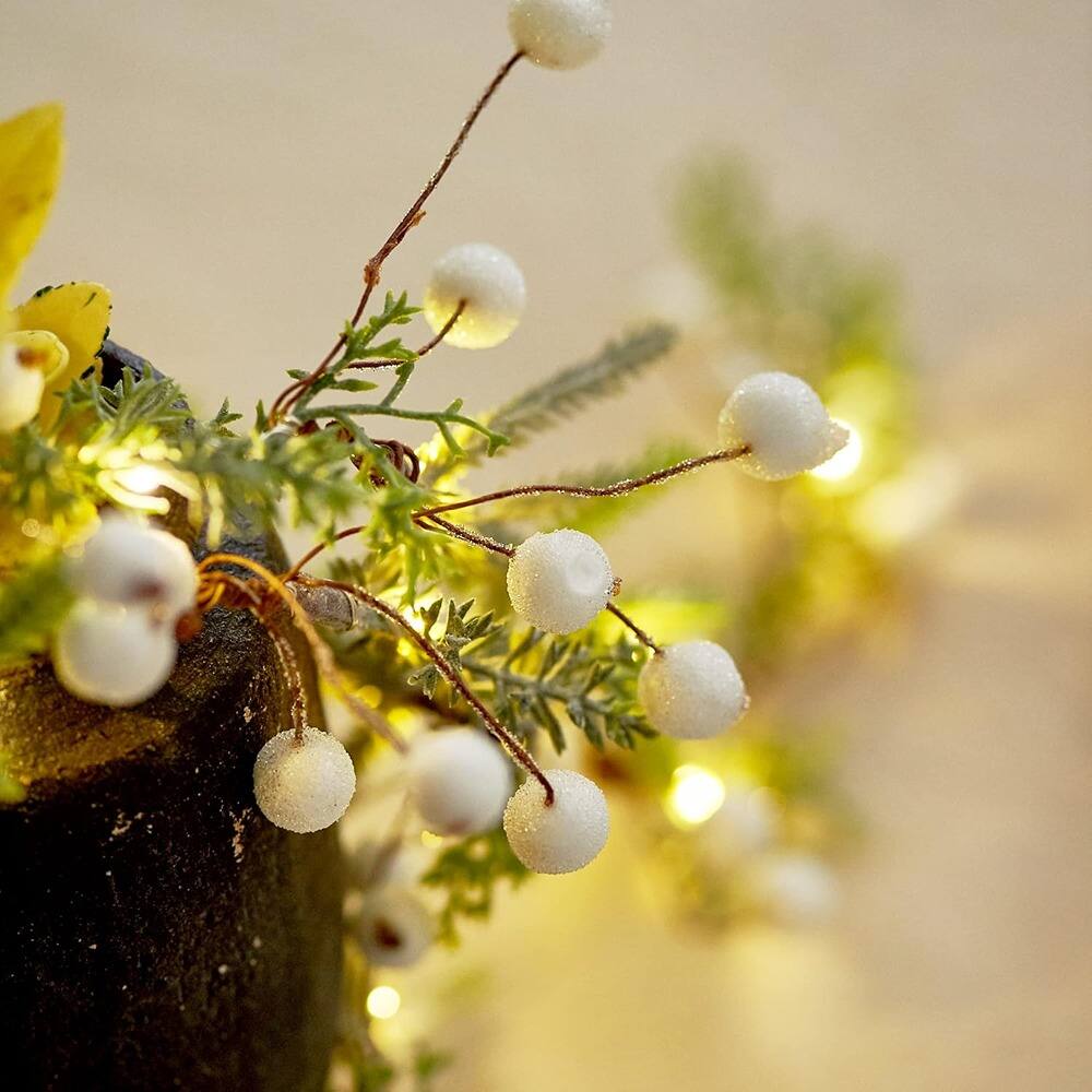 Left. PARKER SLATER - 6.5ft Norfolk Pine Christmas Garland with 25 LED Lights, White Berries, Remote - Green.