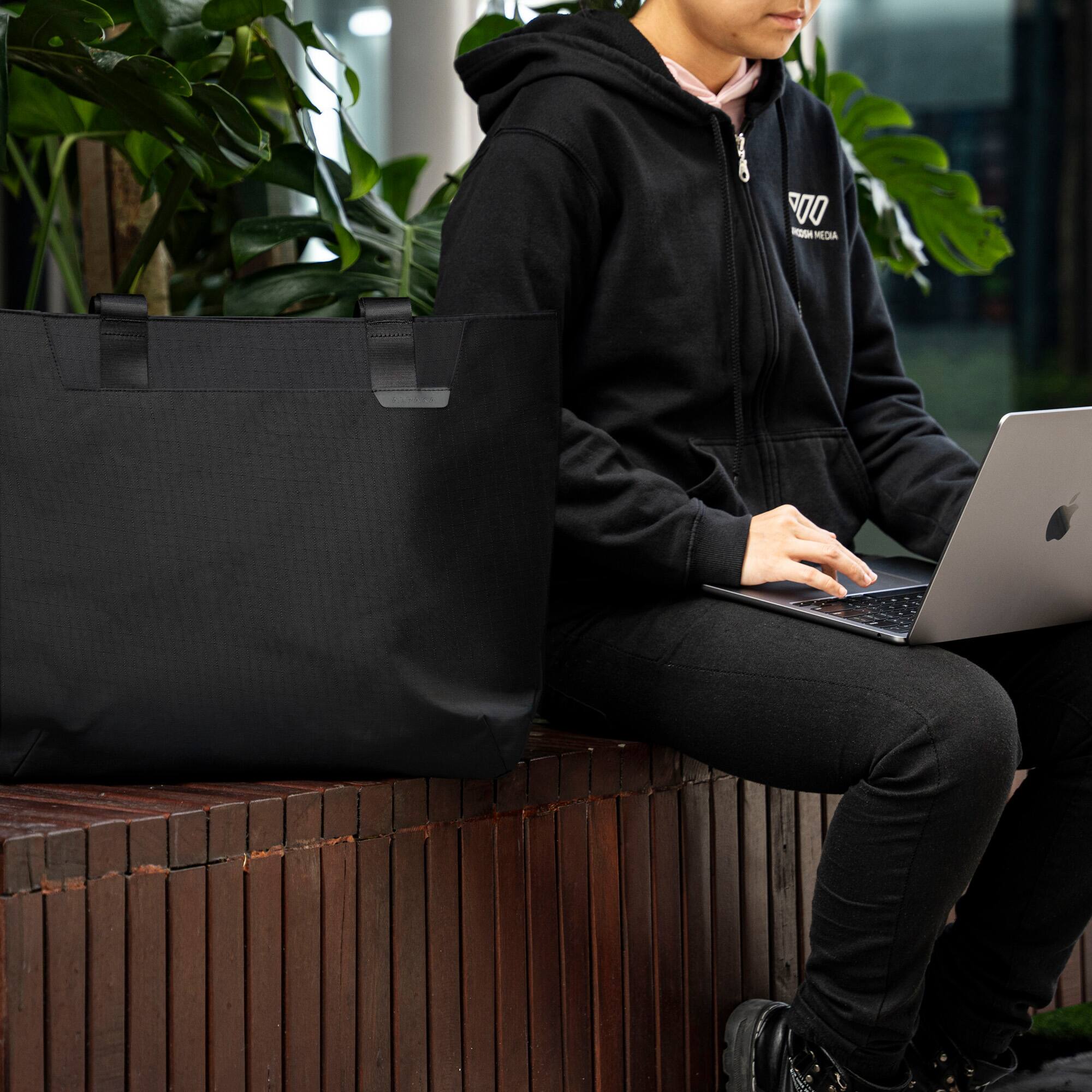 Alt View 2. ALPAKA - Laptop Tote Bag for Work & Travel,20L, Built-in Padded Sleeve for 16" Laptop, Magnetic Open-Top (No Zipper) - Black Axoflux 210D.