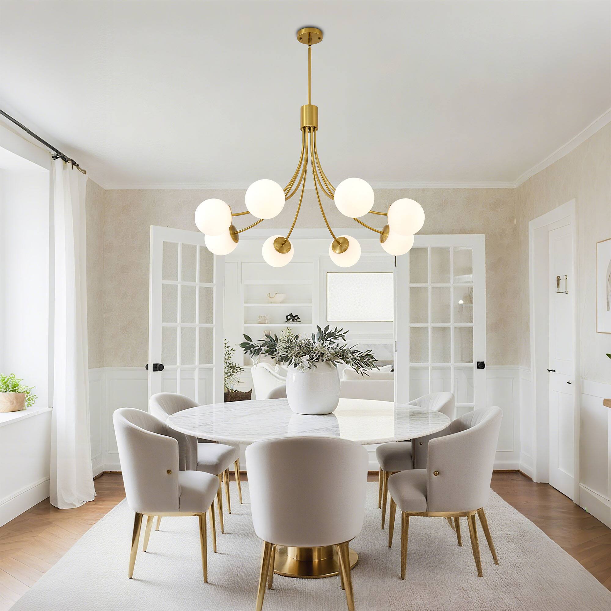 Left. RYHNUYNE - 8-Light Farmhouse Chandelier,Gold Chandeliers Dining Room Light Fixture,Modern Sputnik Chandelier for Living Room Foyer.