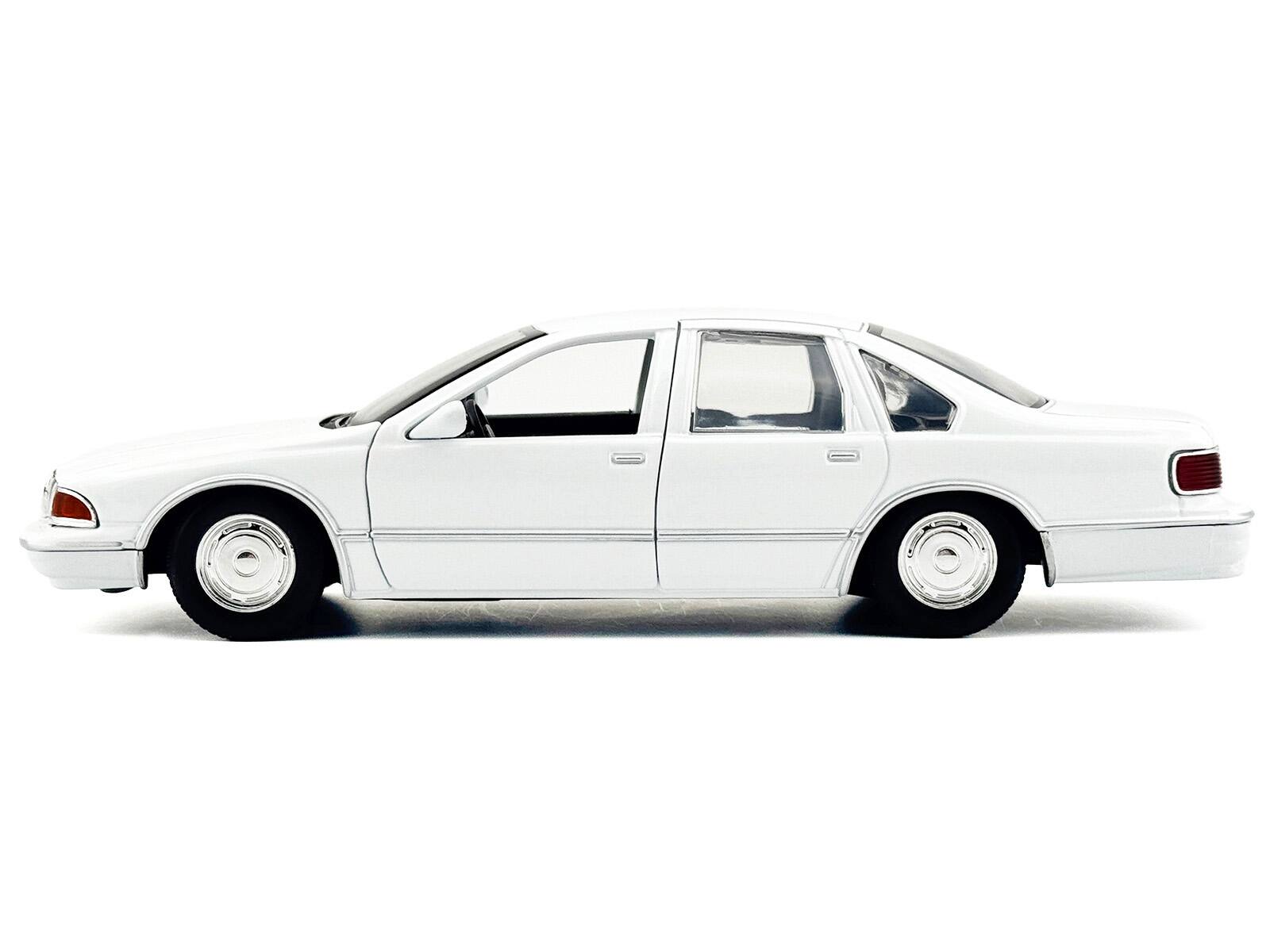 Alt View 2. Motormax - 1993 Chevrolet Caprice Police Car Unmarked White "Custom Builder's Kit" Series 1/24 Diecast Model Car by Motormax.