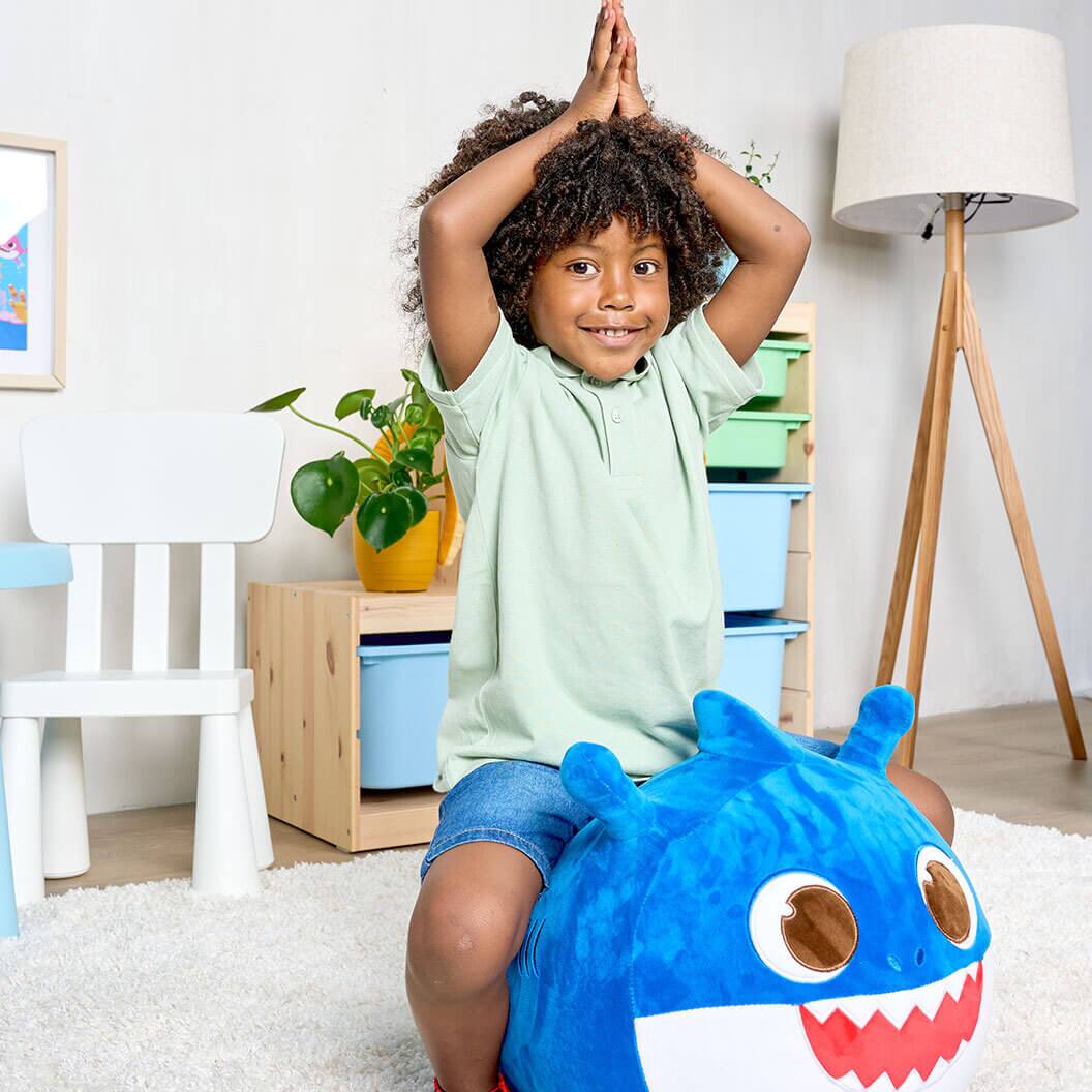 Left. JitteryGit - Pinkfong Daddy Shark Musical Bouncy Ride-On Toy – Soft Plush Hopper with Iconic Song.