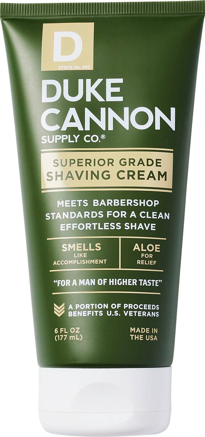 Duke Cannon Supply Co. Superior Grade Shaving Cream meets barbershop standards for a clean, effortless shave. It smells like aloe, providing accomplishment relief. The product is made in the USA and a portion of the proceeds benefits U.S. veterans. The shaving cream comes in a 6 FL oz (177 mL) container.