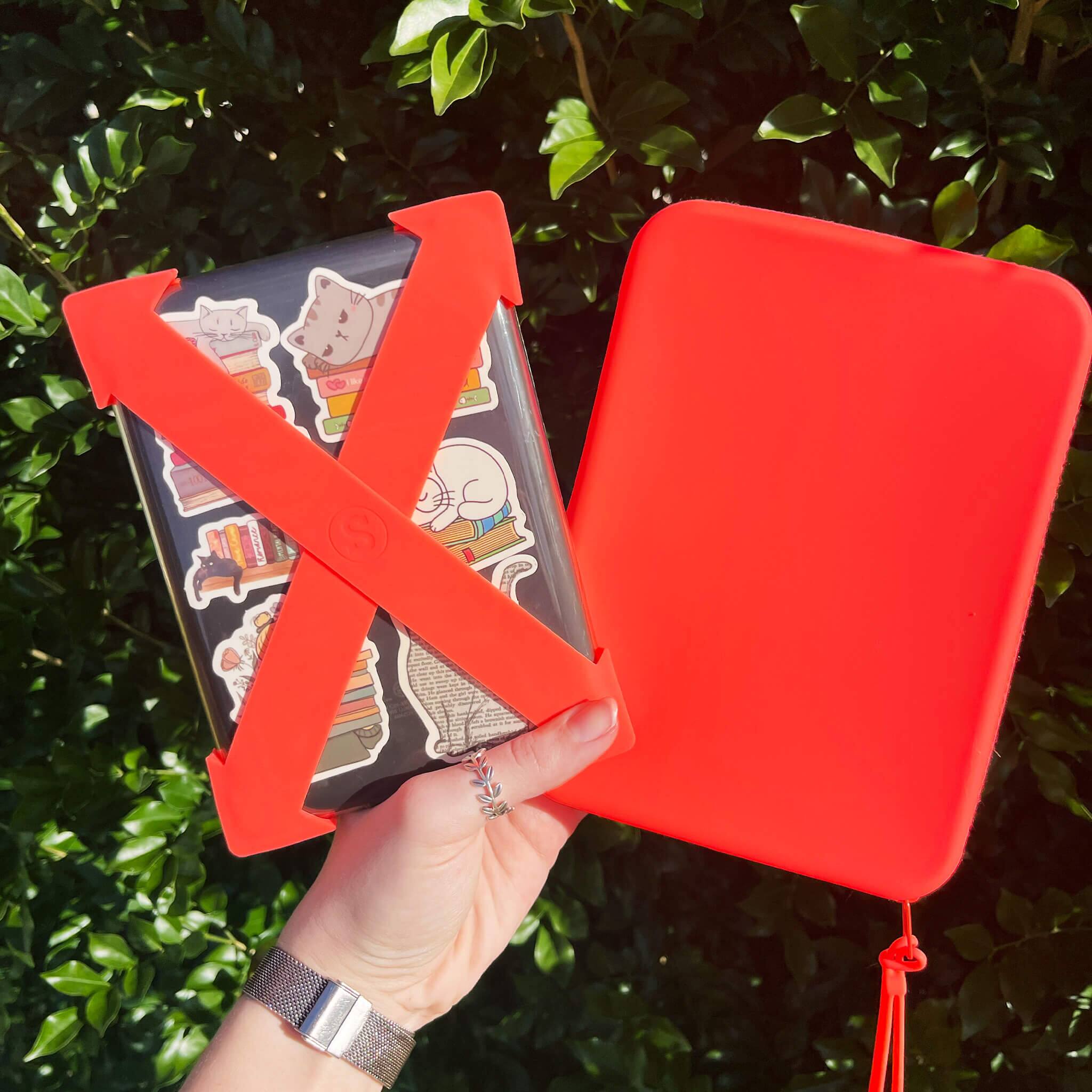 Left. Strapsicle - Clutch for E-Readers - 6.8″–7″ Paperwhite 2024, 6″ Kindles, Kobos, Nook & iPad mini 6 - Anti-Dust Coating - Burnt Orange - Burnt Orange.