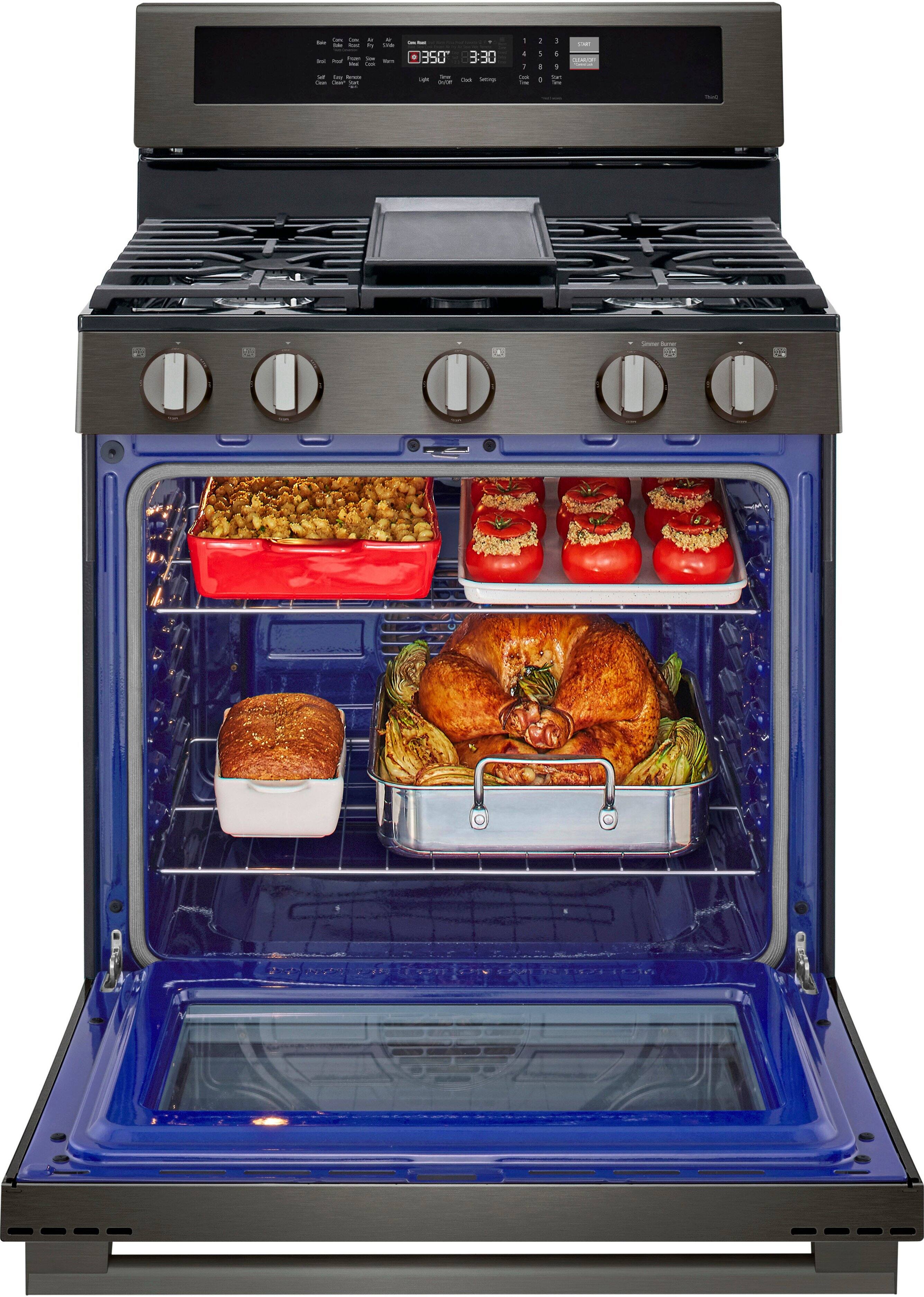 The image shows a blue oven with its door open, revealing a variety of food items inside. There are two casserole dishes, one placed on the top rack and the other on the bottom rack. Additionally, there are two loaves of bread, one on the top rack and the other on the bottom rack. The oven is set to 350 degrees and will be cooking for 3 hours and 30 minutes.