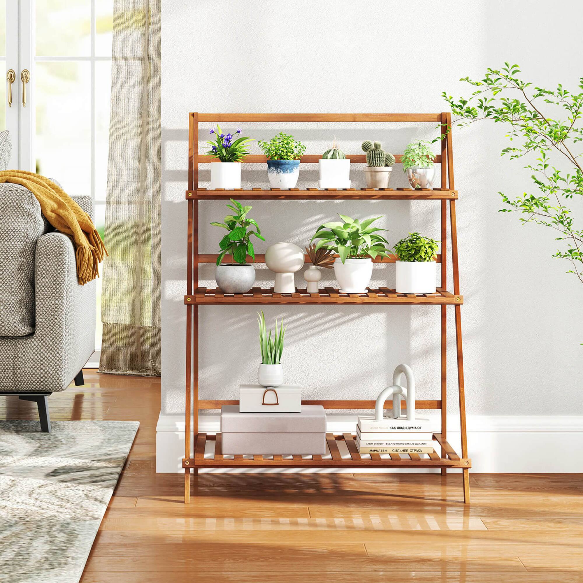 A wooden shelf with a variety of plants and books on it.