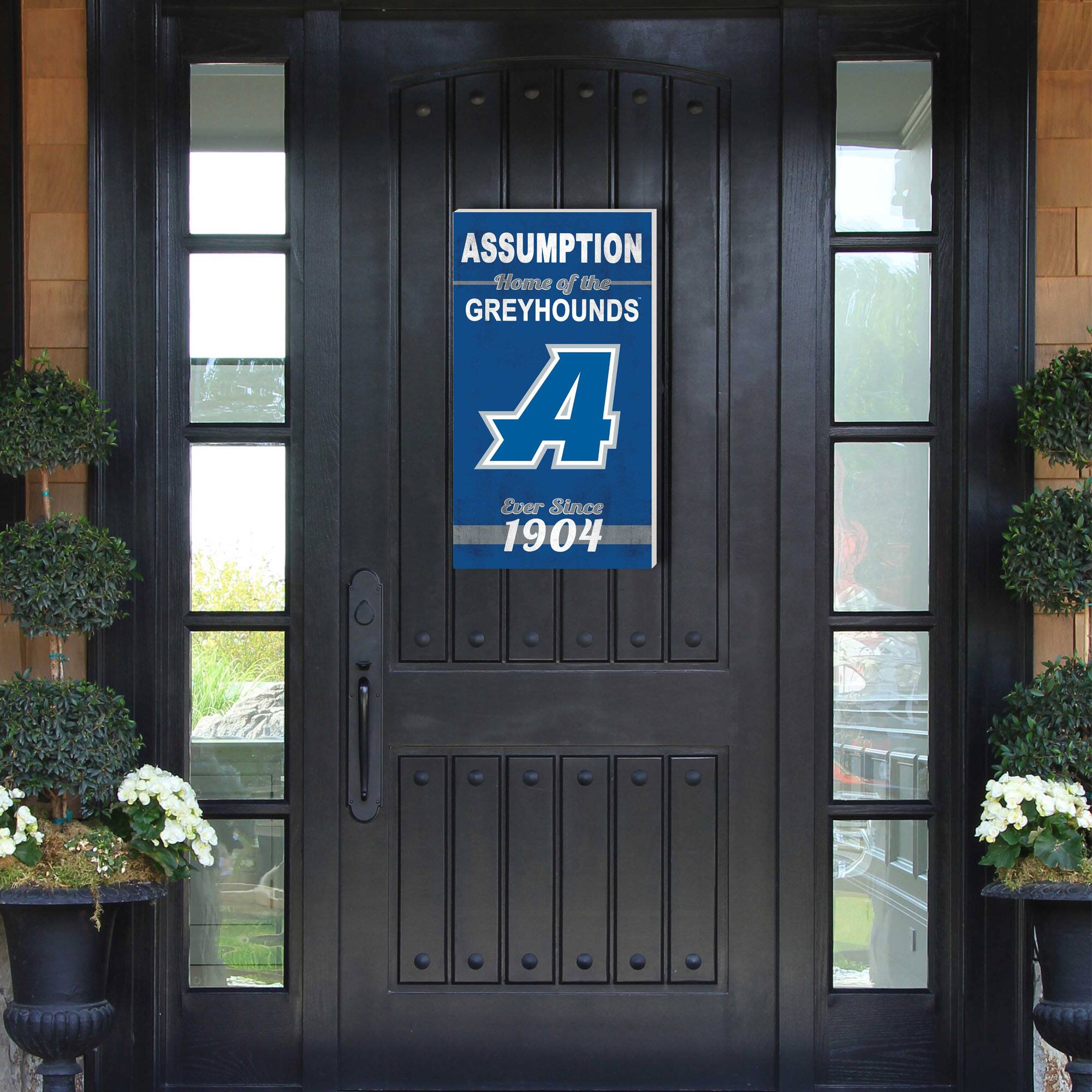 ASSUMPTION Home of the GREYHOUNDS A Ever Since 1904