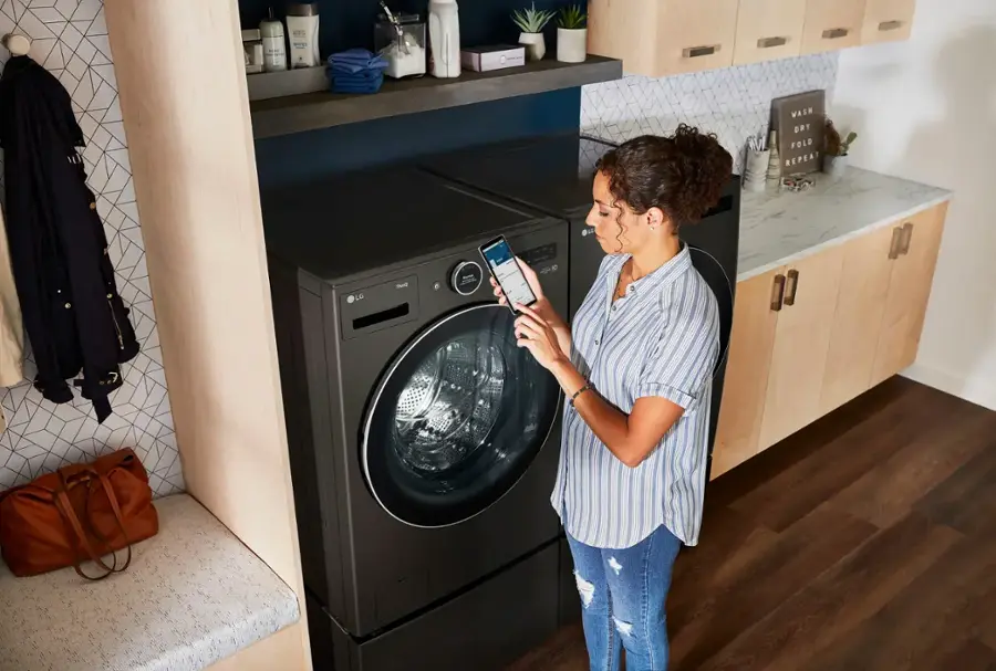 The text on the image reads: "WASH OR DRY FOLD REPEAT DO LG TE."