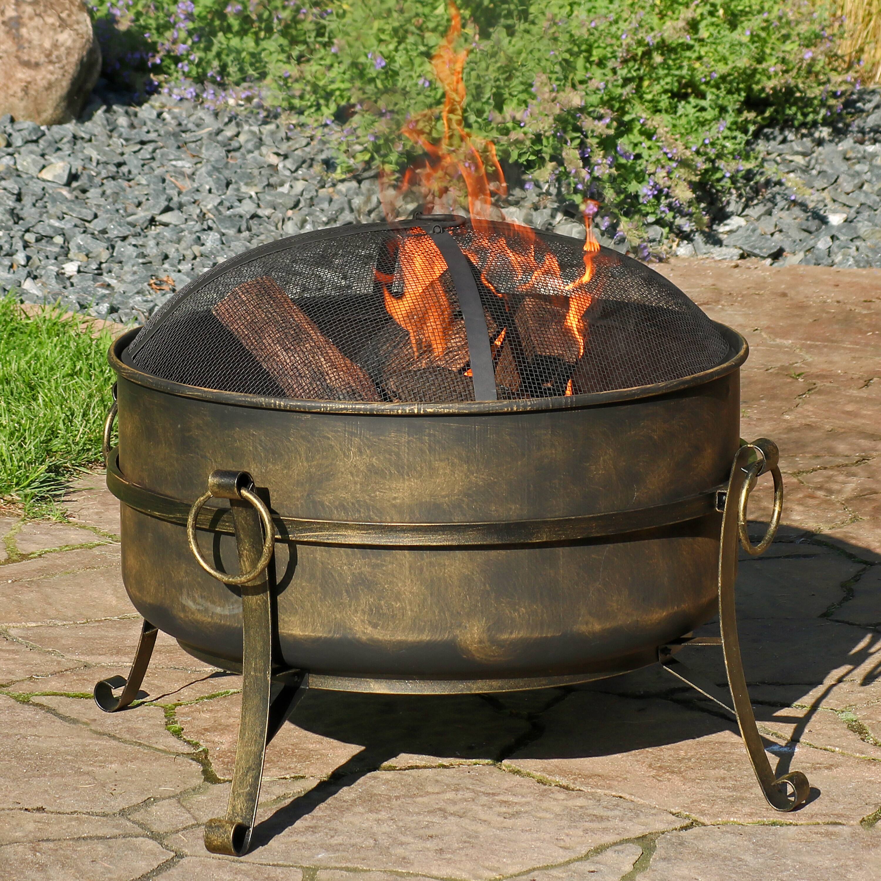 Alt View 1. Sunnydaze - 24 in Cauldron Steel Fire Pit with Spark Screen, Poker, and Grate - Black.