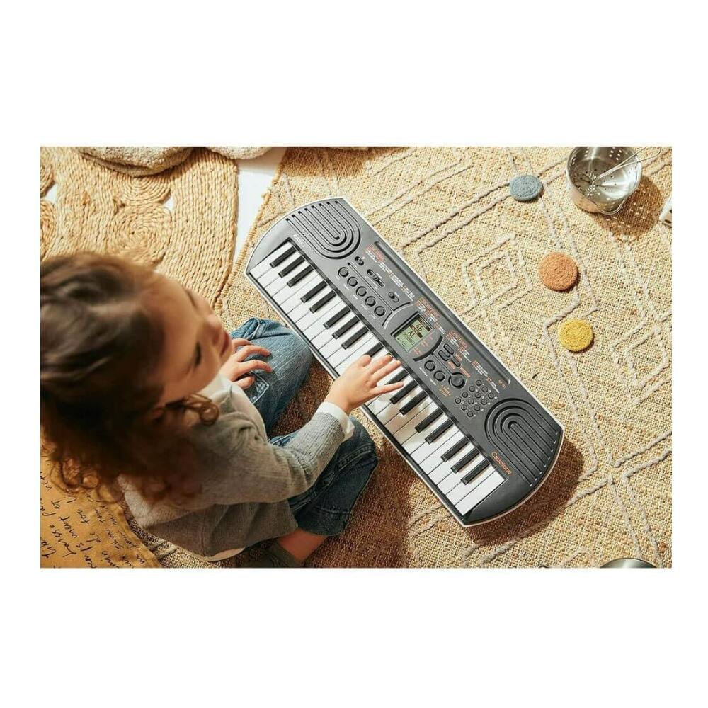 Left. Casio - Casio Casiotone SA-81 Compact Keyboard 44 key with 100 Tones and 50 Rhythms.