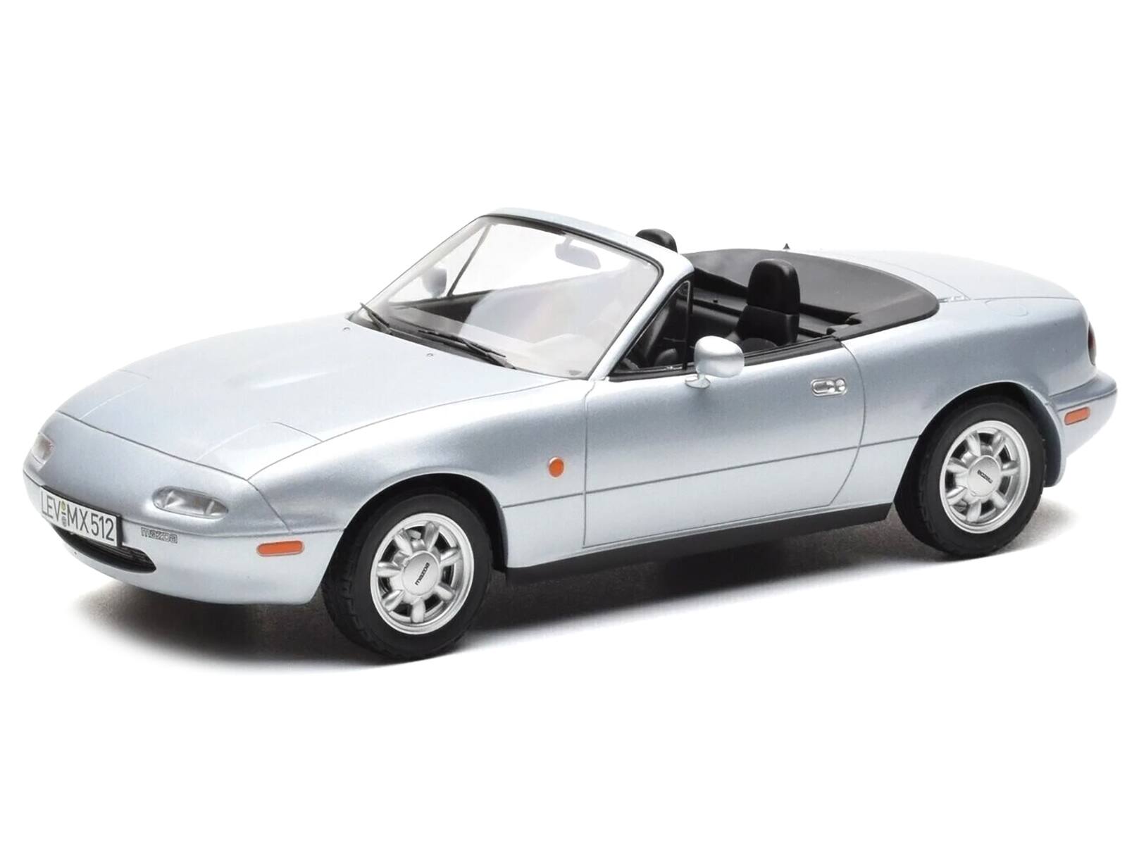 Angle. Norev - 1991 Mazda MX-5 Convertible Silver Metallic 1/18 Diecast Model Car by Norev - Silver Metallic.